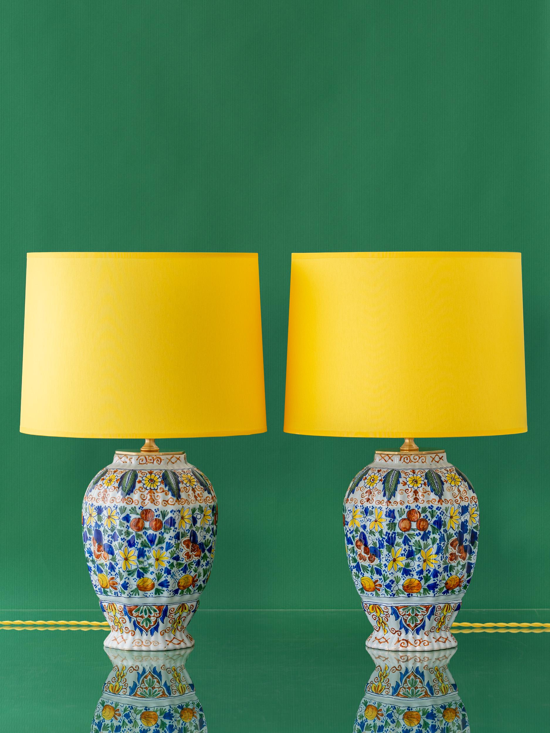 Meticulously handcrafted by Amitābha Studio in Amsterdam, Kara & Kusa are a one-of-a-kind pair of table lamps created from antique hand-painted vases (circa 1890) in the Delft style by Royal Tichelaar Makkum, the oldest ceramic company in the