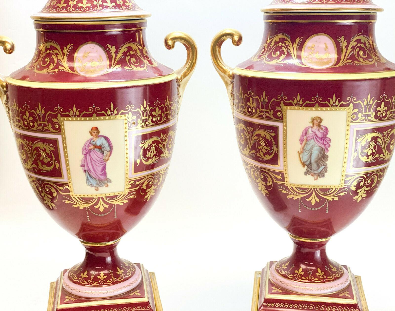 Early 20th Century Royal Vienna Austria Hand Painted Porcelain Double Handled Urns For Sale