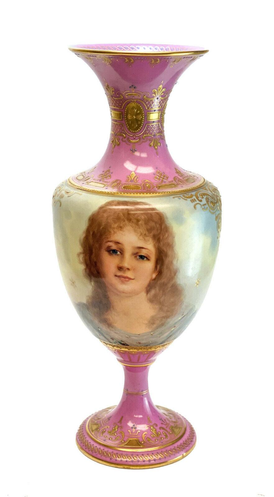 Royal Vienna Austria hand painted porcelain footed vase, circa 1900. The vase depicts a profile portrait of a blonde and brunette beauty to either sides. Artist singed 