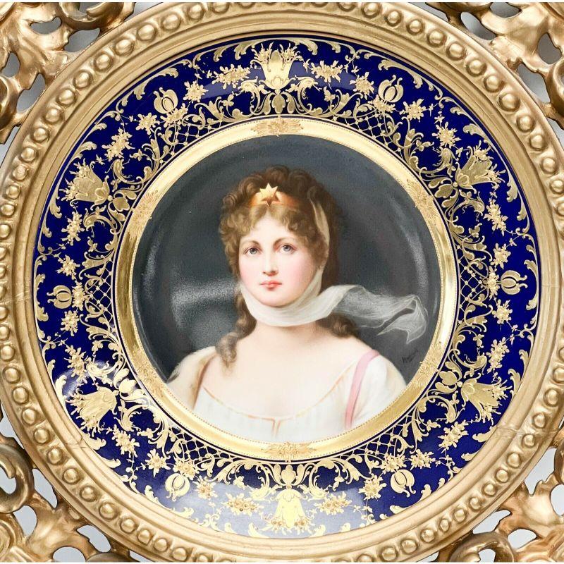 Royal Vienna austria hand painted porcelain portrait Queen Louise plate in frame.

circa 1920. A cobalt blue ground to the edge with raised gilt foliate decoration. A hand painted portrait to the center of Queen Louise of Prussia. Artist signed to