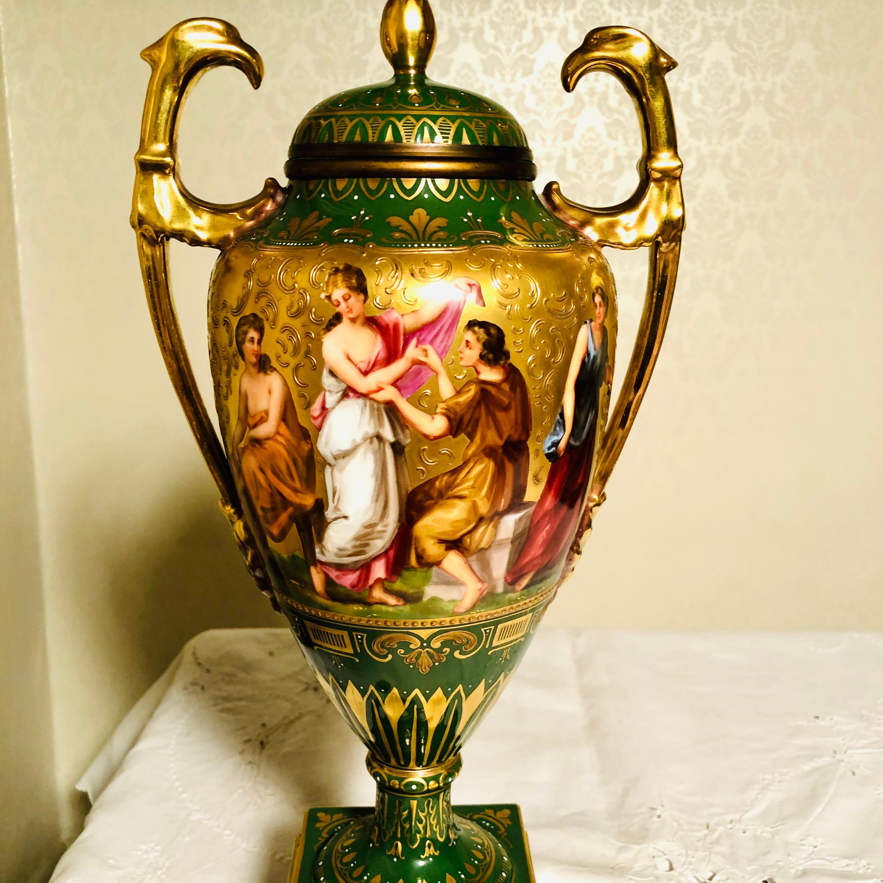 I want to offer you this amazing “Royal Vienna” style urn with a green background with exquisite paintings on both sides. The paintings are entitled 