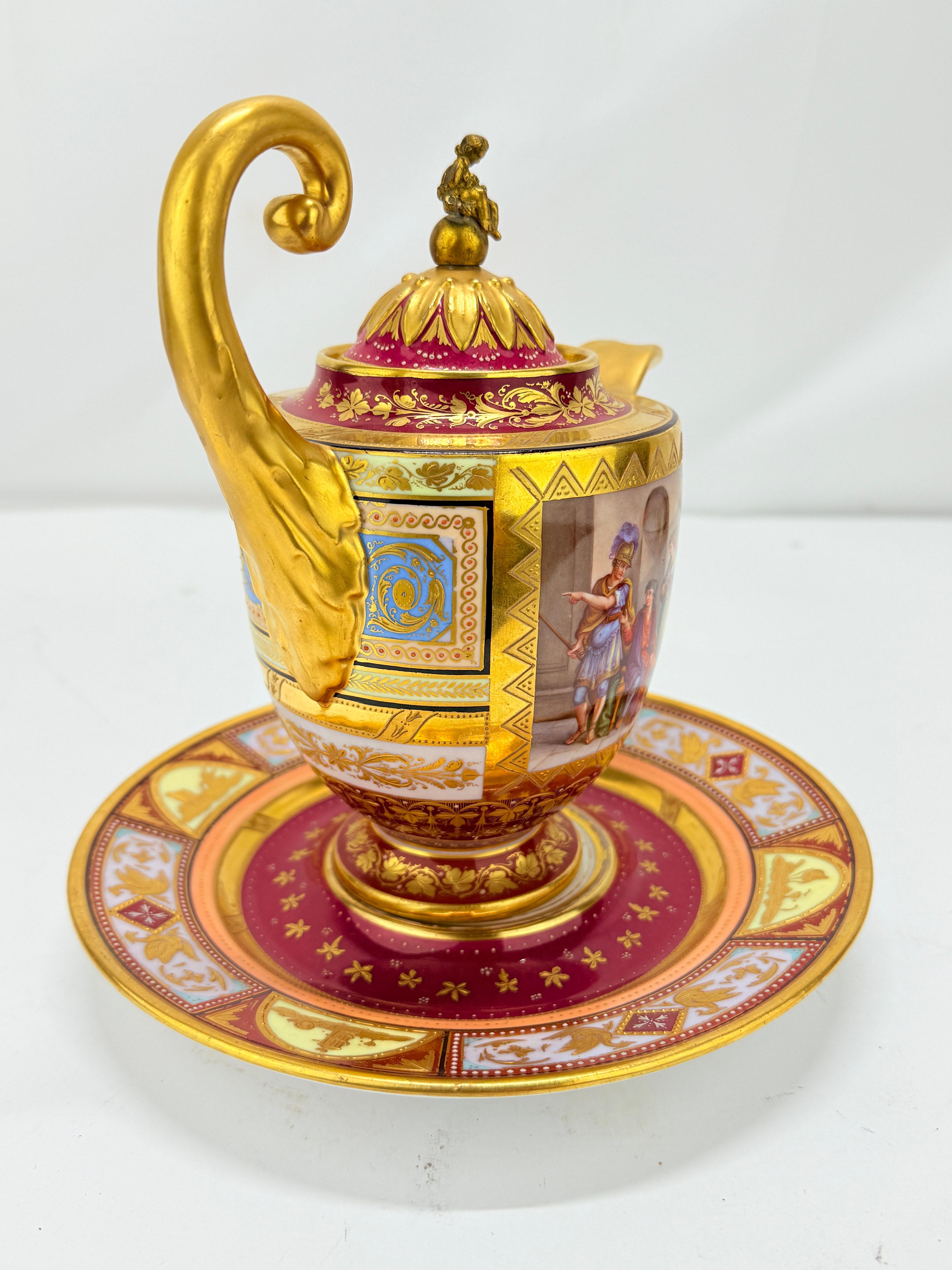 A superb and richly decorated early 19th-century Royal Vienna porcelain covered pitcher and matching underplate, finely executed in the neoclassical taste with lavish gilding and polychrome enamel decoration. The baluster-form pitcher rises on a