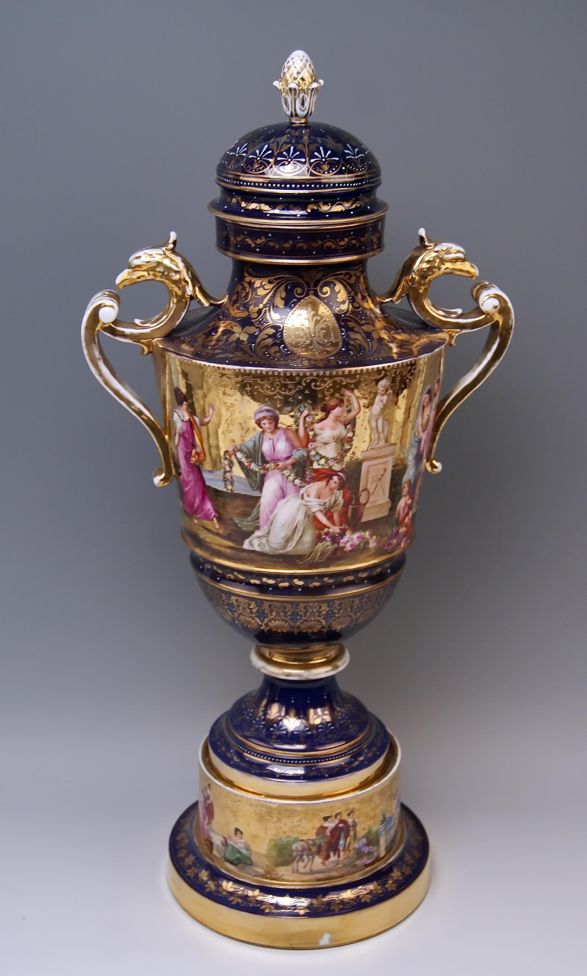 Gorgeous huge porcelain two-handled goblet, abundantly painted of Royal Vienna Porcelain Manufactory: Finest quality / the goblet's surface is covered with golden color on which various multicolored painted figurines deriving from ancient mythology