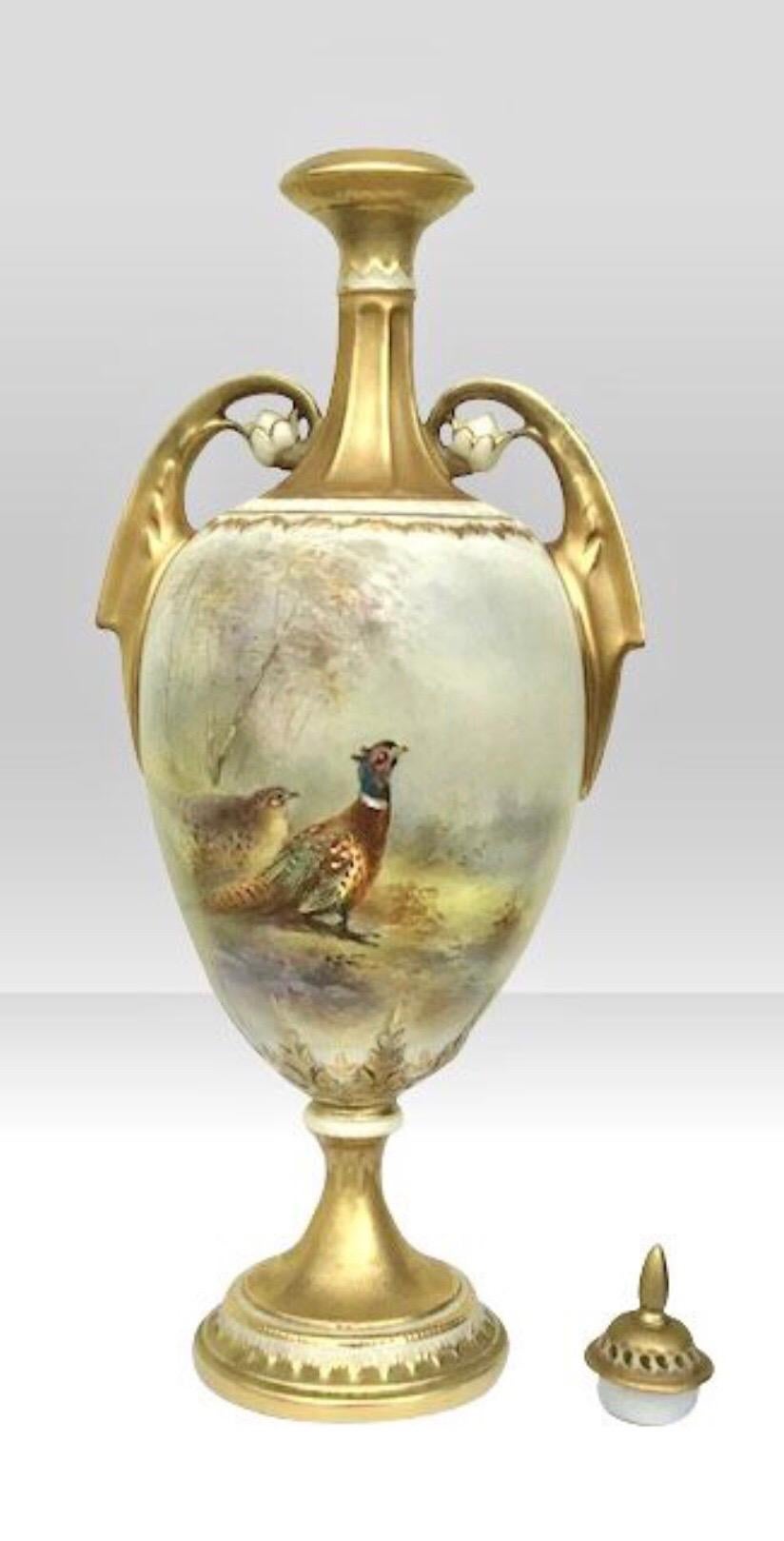 Royal Worcester antique James Stinton vase with cover.
Cock and Hen Pheasant in Wooded Glade.
Dated 1921
Measures: 32.5cm x 13cm x 10cm deep.