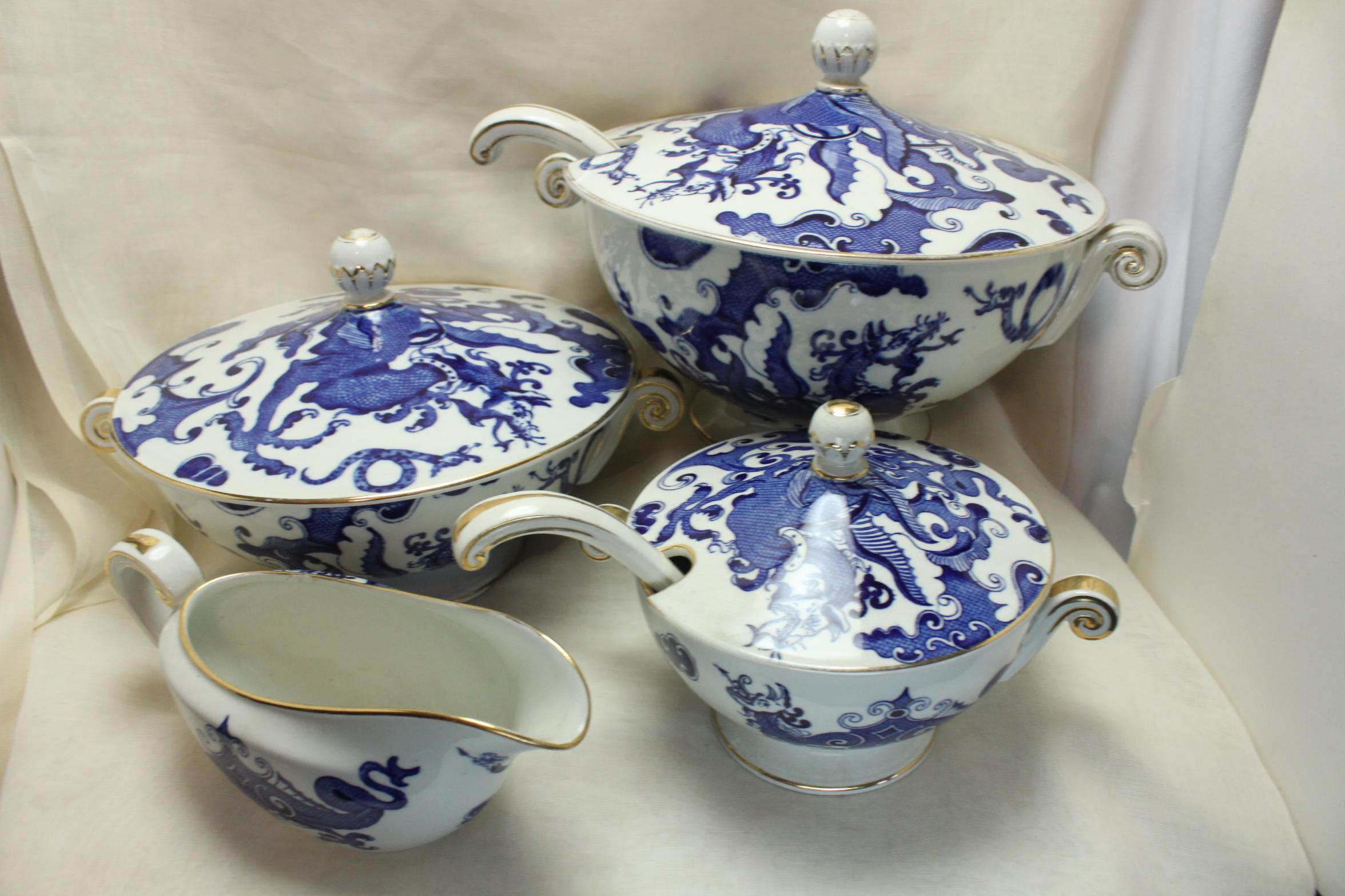 This very striking Royal Worcester Crown Ware blue and white part dinner setting for six is decorated with a transfer printed dragon pattern that was first used by Grainger, Lee & Co in Worcester in the 1820's, and finished off with gilding to the