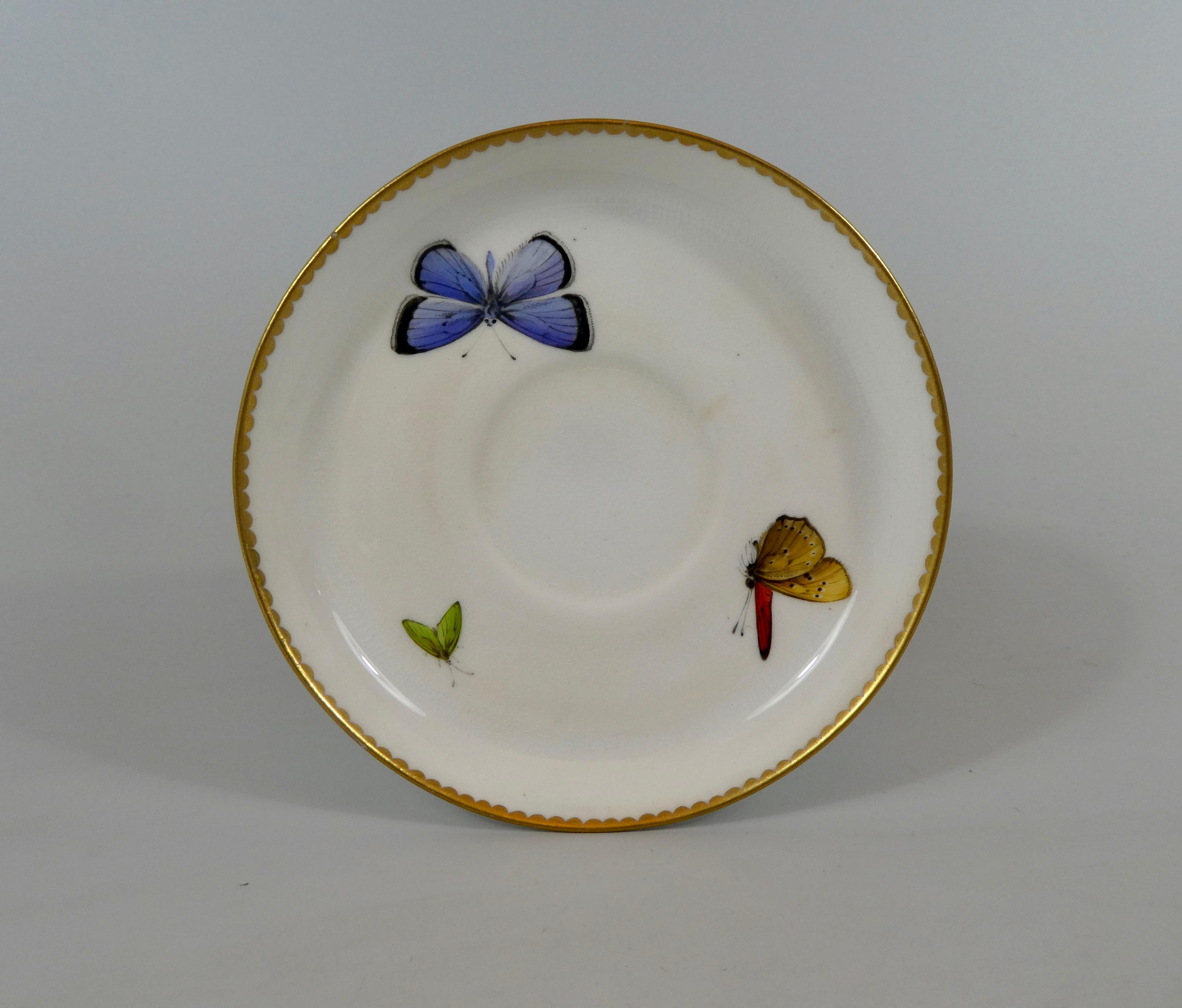 A rare royal Worcester ‘Butterfly’ porcelain cup and saucer, dated 1880. The cup modelled with a large butterfly handle, beautifully hand painted in enamels, and gilt. Both the cup and saucer, hand painted with further butterflies, within a gilt
