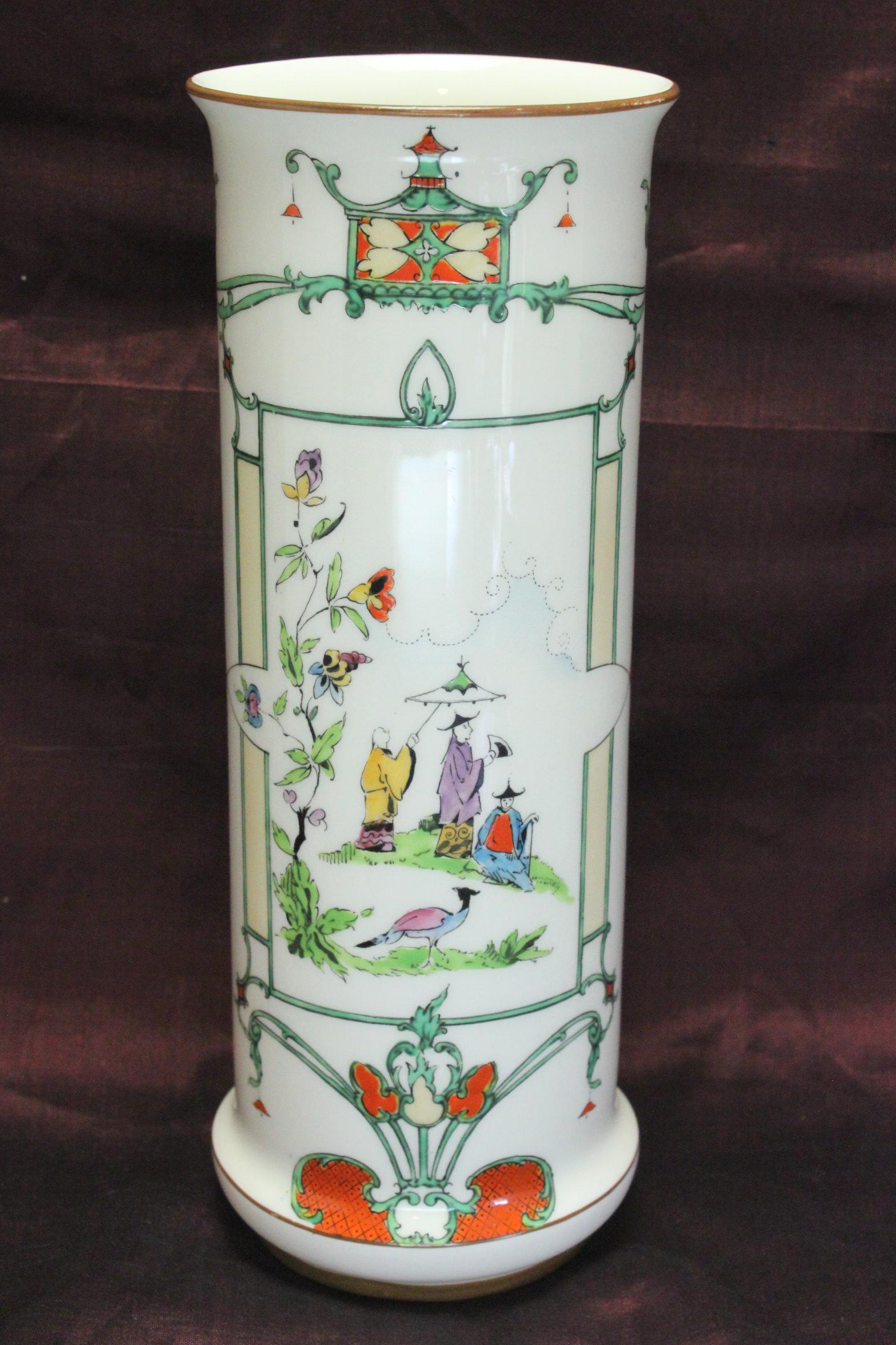 This tall Royal Worcester porcelain vase features an unusual printed and hand enamelled Chinoiserie pattern. Although this piece isn't marked with the pattern number, the pattern is W9882. The shape number is 2510, which was introduced in 1910 and