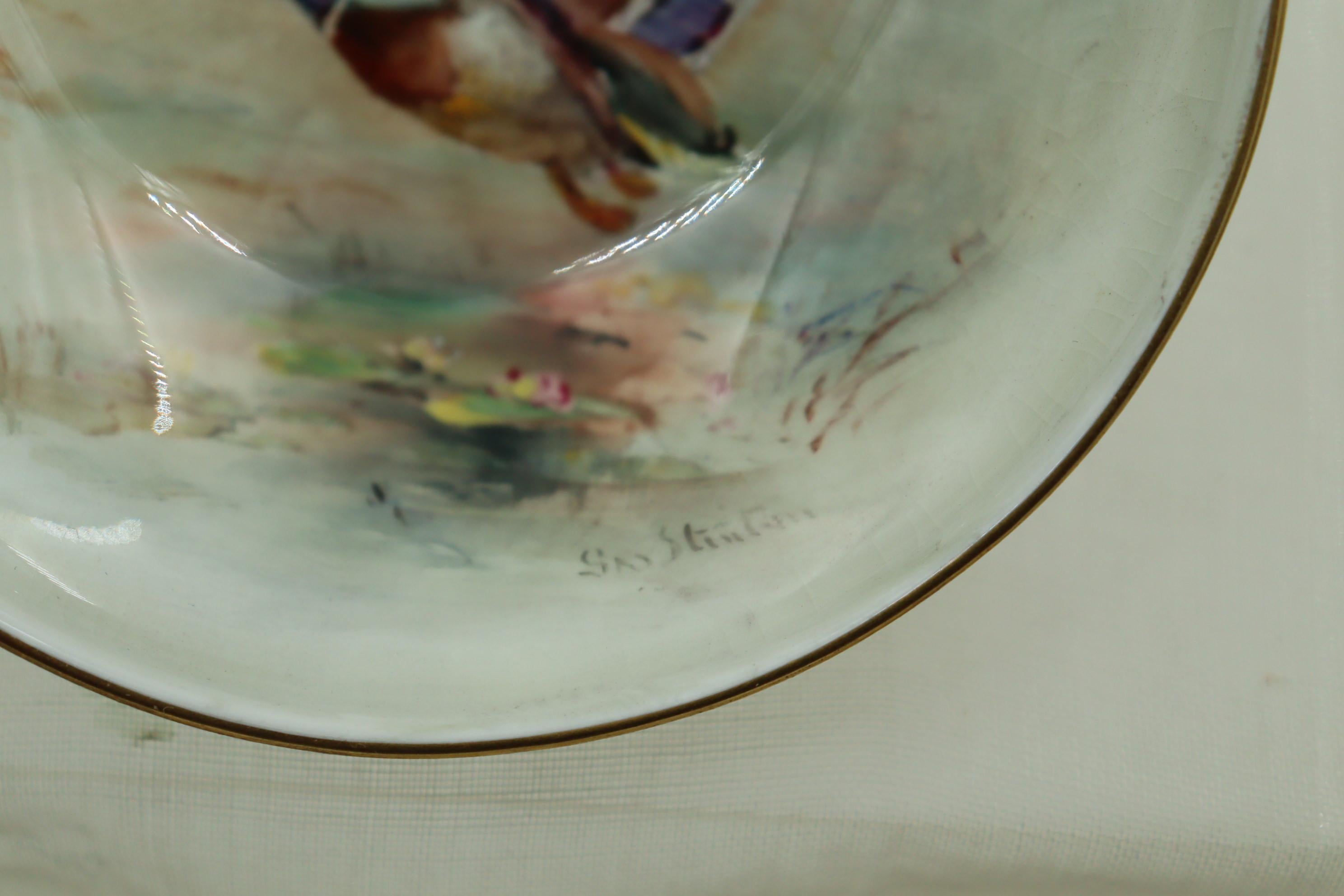 This Royal Worcester footed dish was painted by James Stinton (1870-1961) and features a pair of ducks in flight. The son of John Stinton senior, James Stinton was a member of the famed Stinton family of porcelain painters whose history dated back