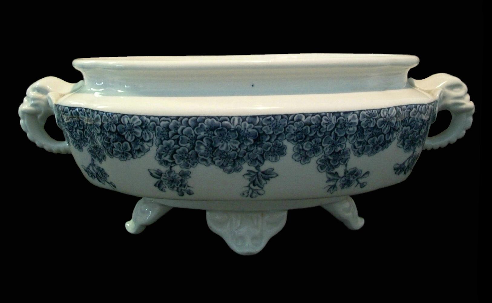 Royal Worcester - Dr. Christopher Dresser (Attributed) - Antique English blue and white transfer decorated twin handled porcelain center bowl or tureen - cast elephant head handles - set on four bracket feet - printed mark on the base - impressed -