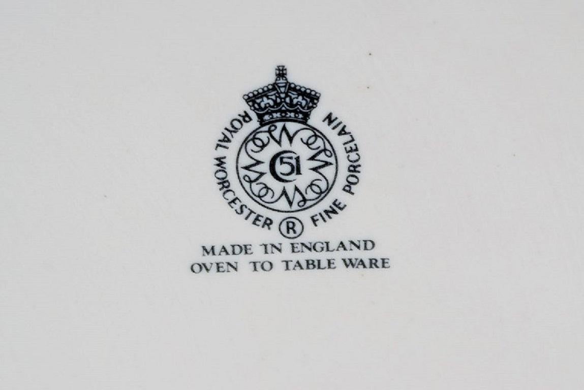 Porcelain Royal Worcester, England. A pair of Evesham porcelain serving bowls. 1960s/70s