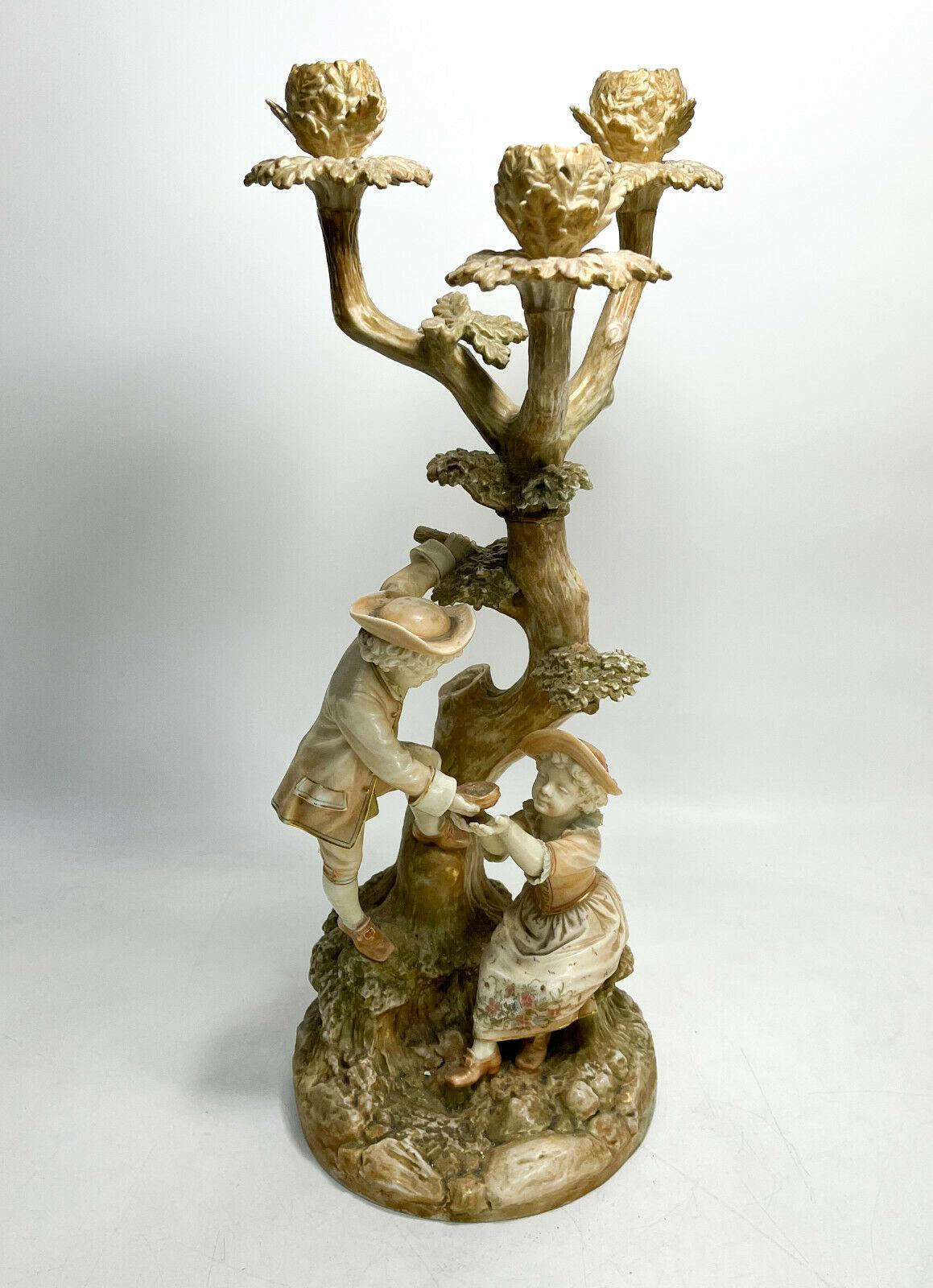 Royal Worcester England Porcelain Figural Candelabra by Hadley, 1886

The candelbra modeled after a tree with two young children in period era garbs. Artist signed 