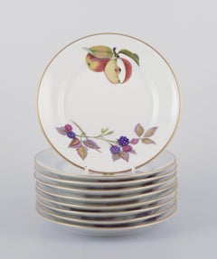 Royal Worcester, England. Set of nine Evesham porcelain plates with fruit motifs