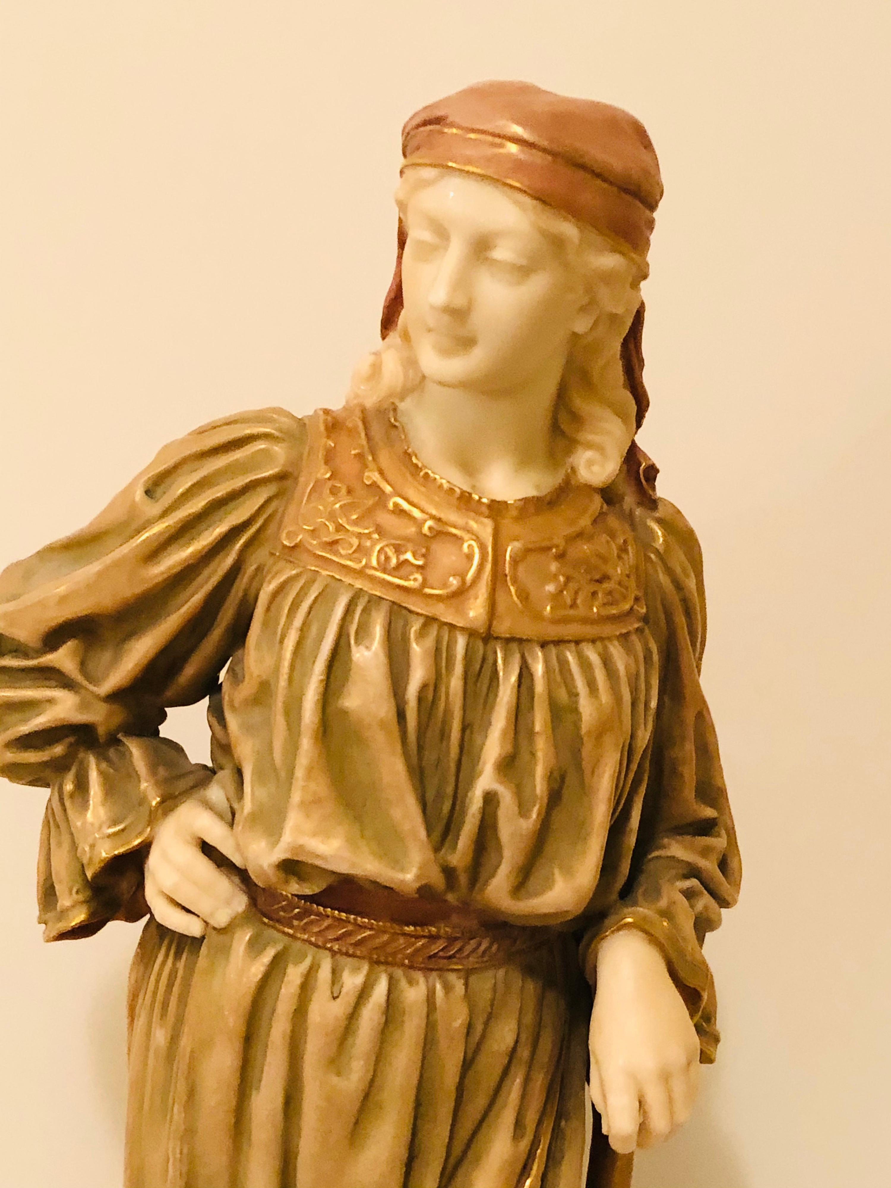 I would like to present you with this amazing Royal Worcester figure of a beautiful lady gardener. She looks like a shepherdess with a long flowing dress and turban type headdress. She has a lot of detail including her ruffled sleeves and her work