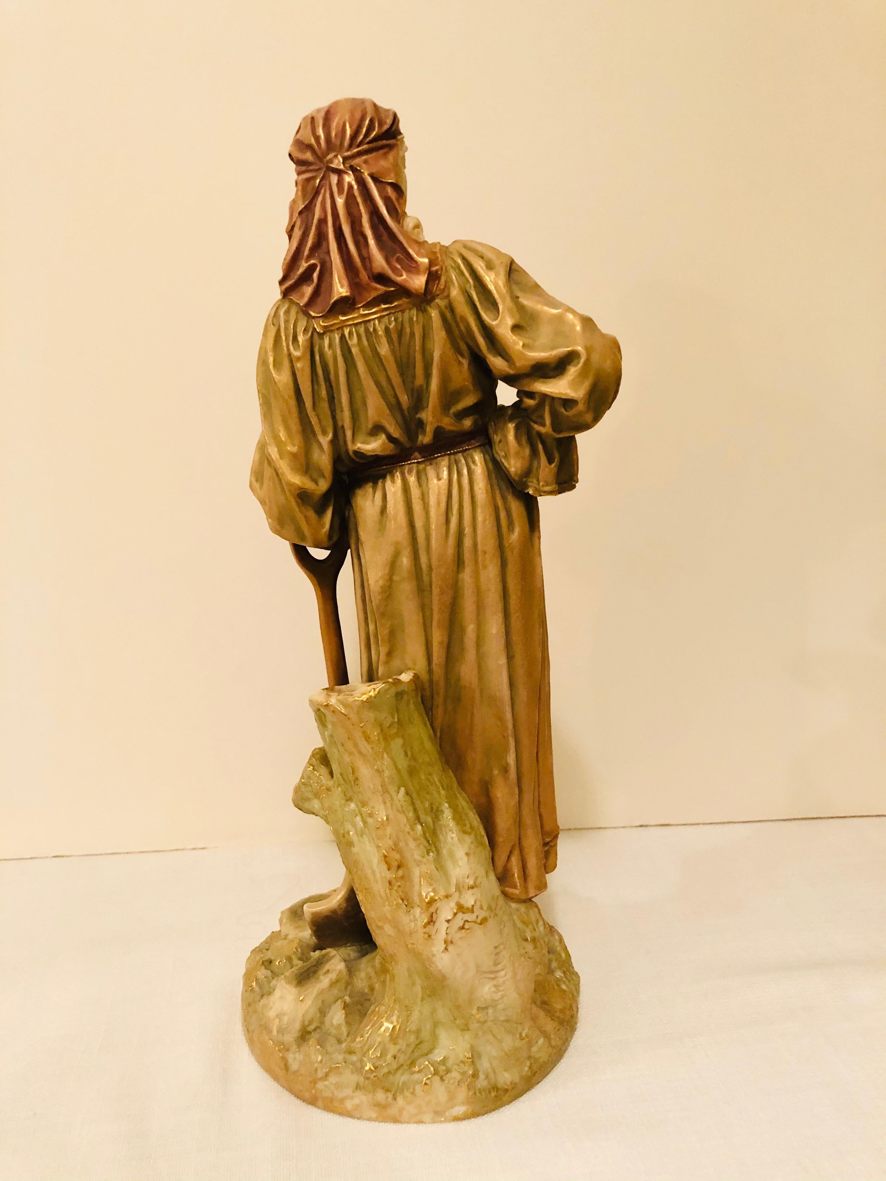 Hand-Painted Royal Worcester Figure of a Lady Gardener Wearing a Flowing Dress and Hat