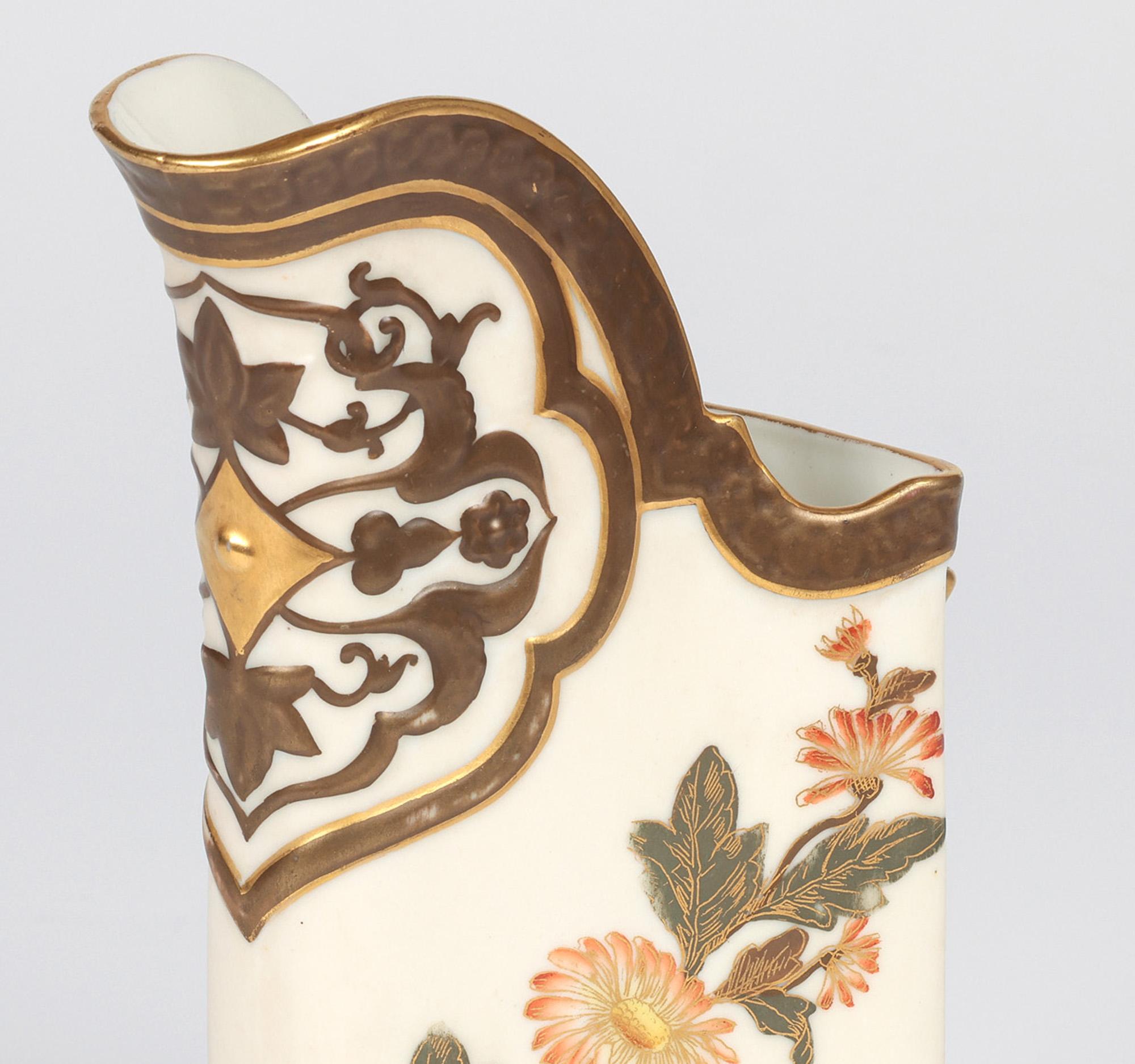 A very fine Aesthetic Movement Royal Worcester triangular shaped jug hand painted with flowers and butterflies and made for Bailey Banks & Biddle in Philadelphia dated 1882. The porcelain jug is very reminiscent of the designs of Christopher Dresser