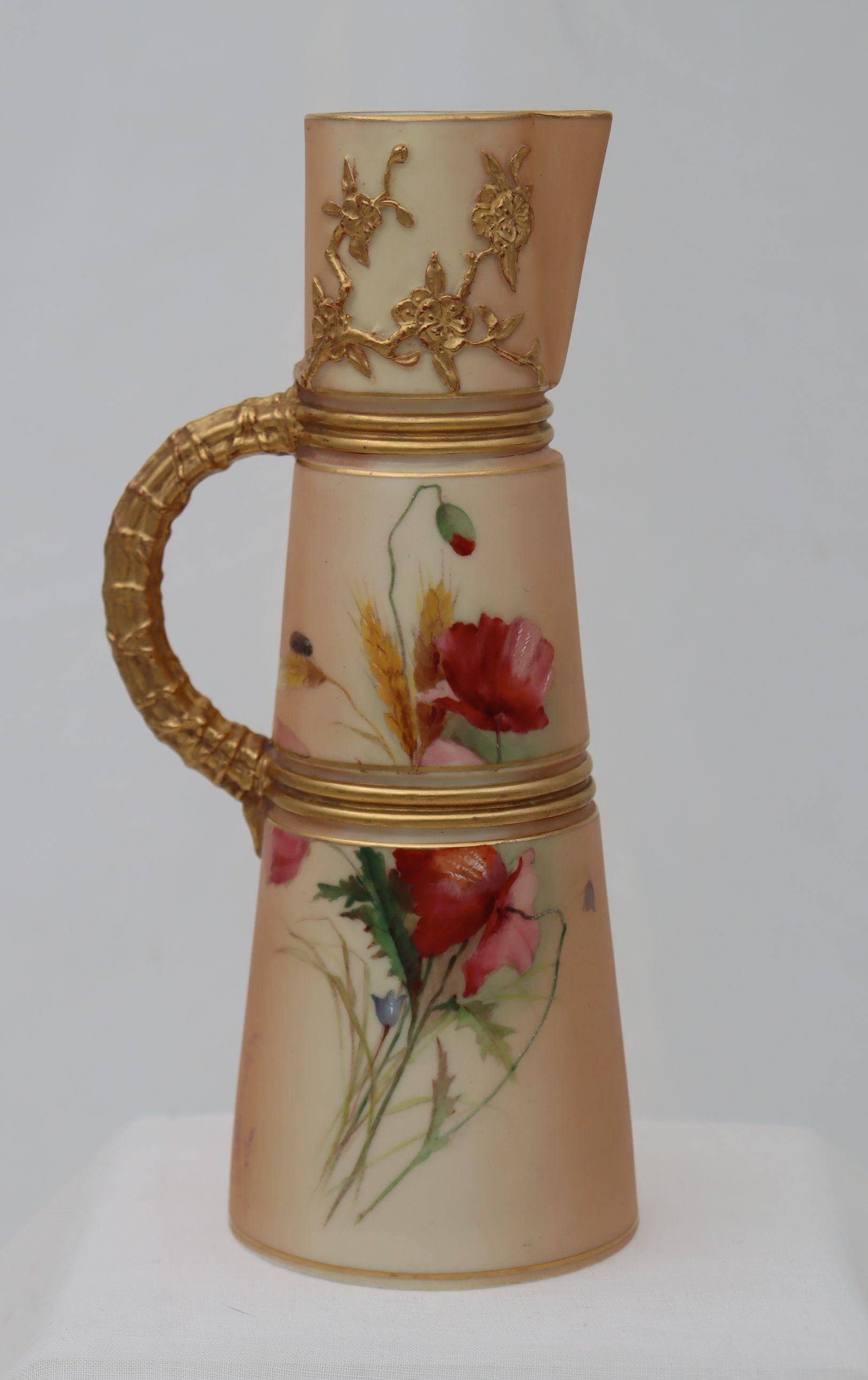 Royal Worcester offered four sizes of this claret jug shape, the shape being number 1047, which was first issued in 1884. This one stands 224 mm (8.75 inches) high and measures 83 mm (3.25 inches) across the base.  This example is decorated to the