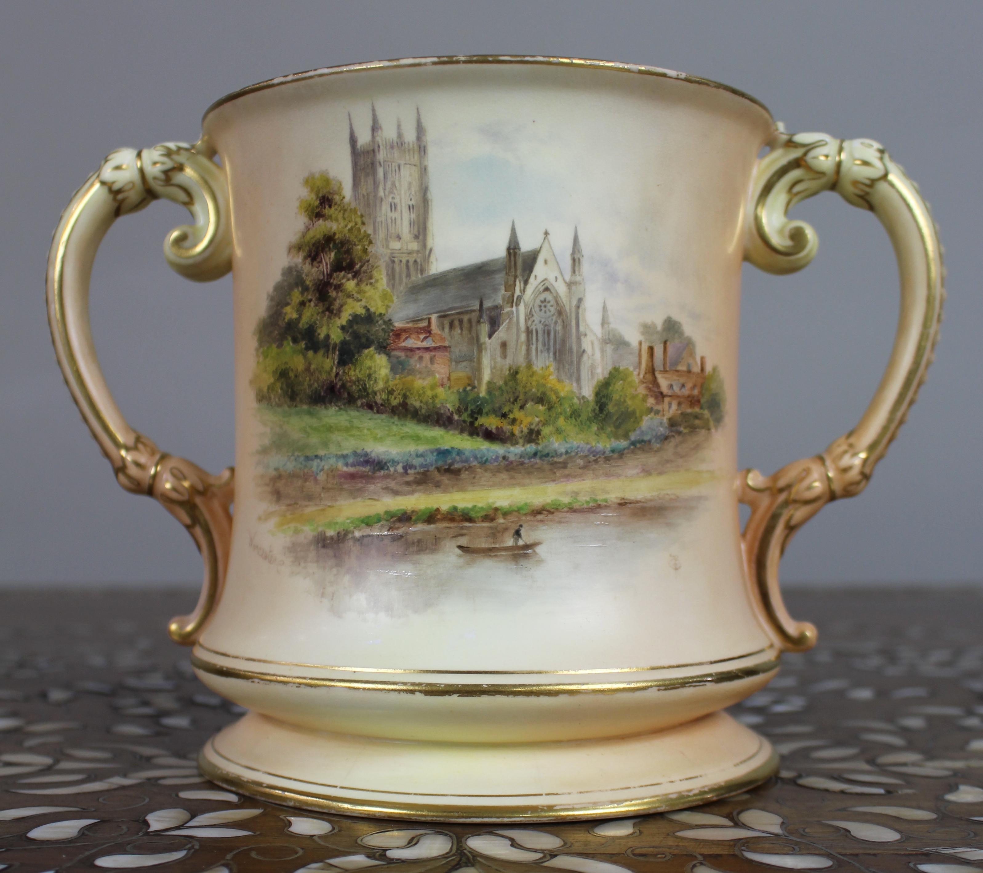 Royal Worcester Loving Cup – Hand-Painted Worcester Cathedral, Signed Monogram, c.1902

A finely hand-painted Edwardian Royal Worcester twin-handled loving cup, depicting Worcester Cathedral from the River Severn with a lone boatman in the
