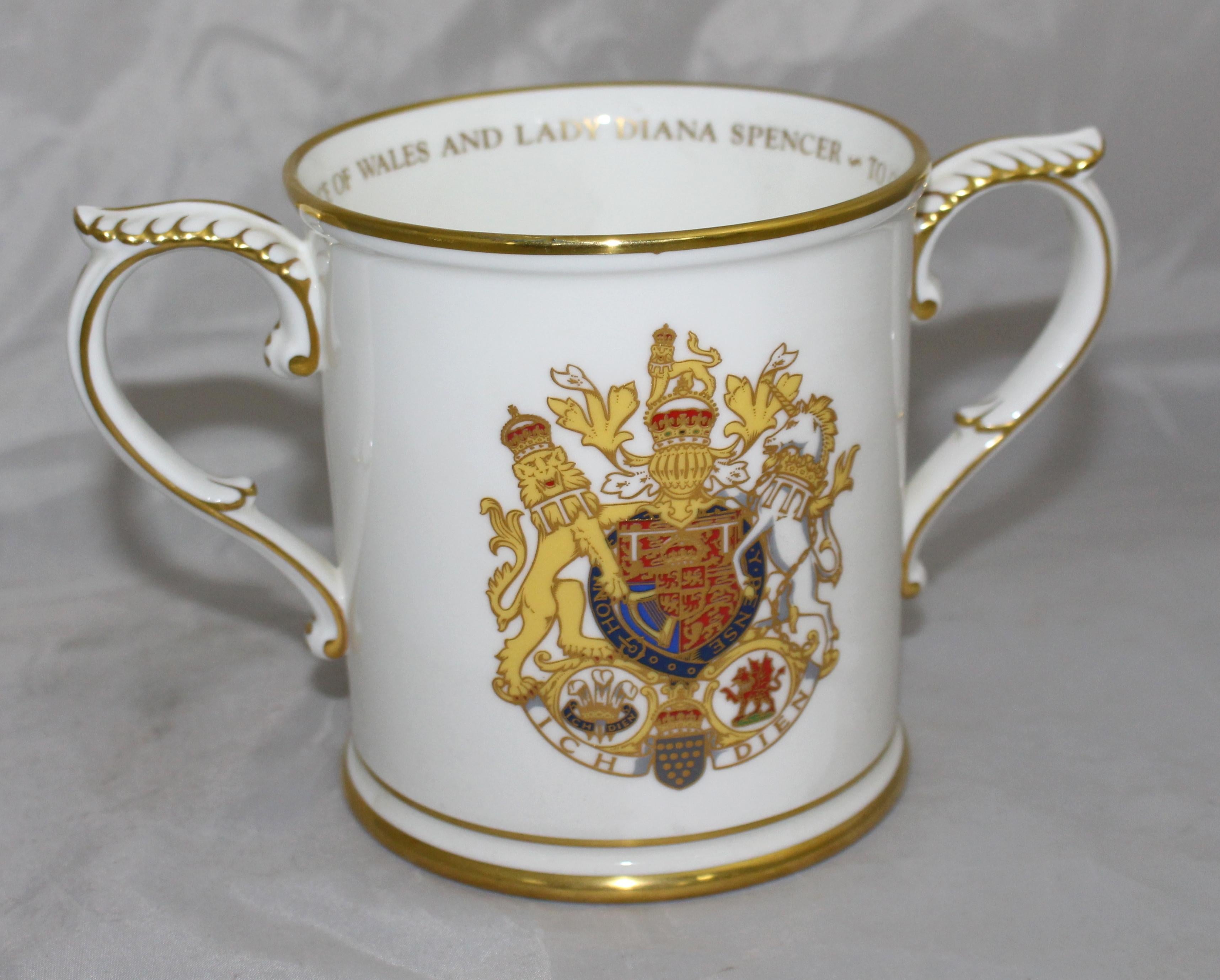 Manufacturer Royal Worcester
Title The Royal Marriage Loving Cup
Date 1981
Measures: Width 19.5 cm / 7 3/4 in
Depth 11.5 cm / 4 1/2 in
Height 12 cm / 4 3/4 in
Limited Edition 1000
Backstamp Fully backstamped, first quality
Condition