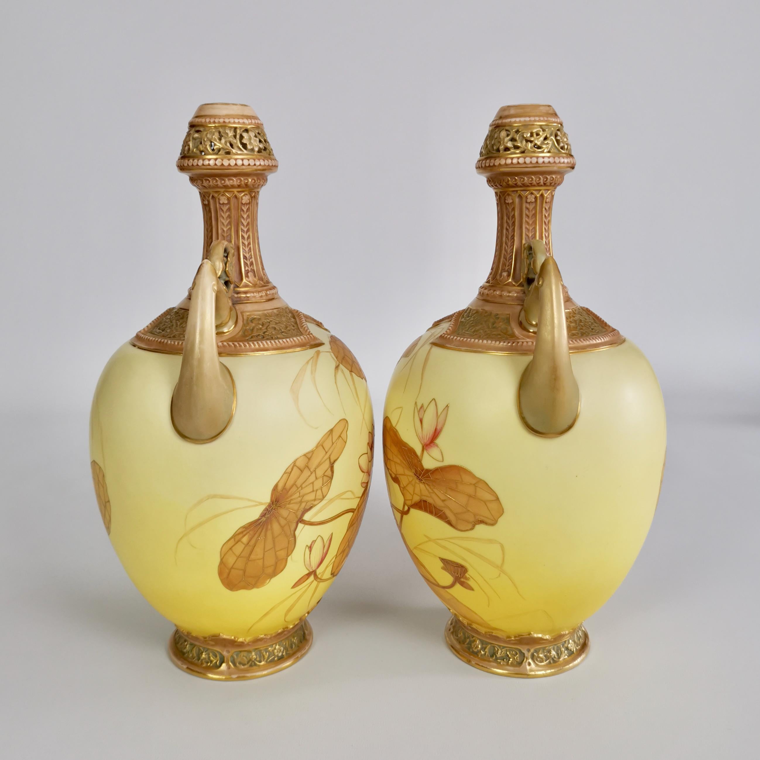 This is a superb pair of vases made by Royal Worcester in the year 1890. The vases are shaped in the Persian style and have a blush ivory Japanese lotus decoration.

The original Worcester factory was founded in the mid-18th century and belongs to