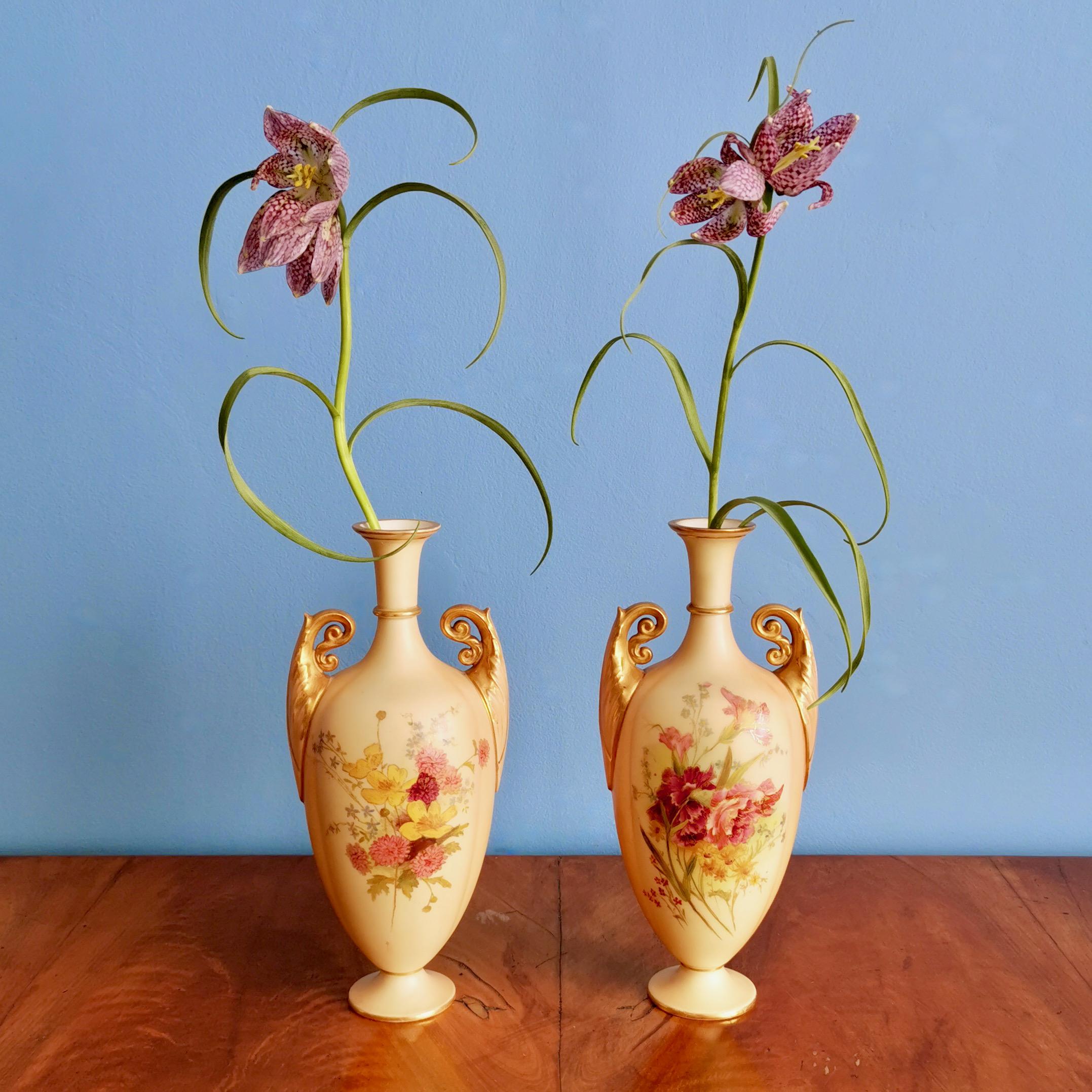 This is a very fine pair of small vases made by Royal Worcester in 1907. The vases have a 