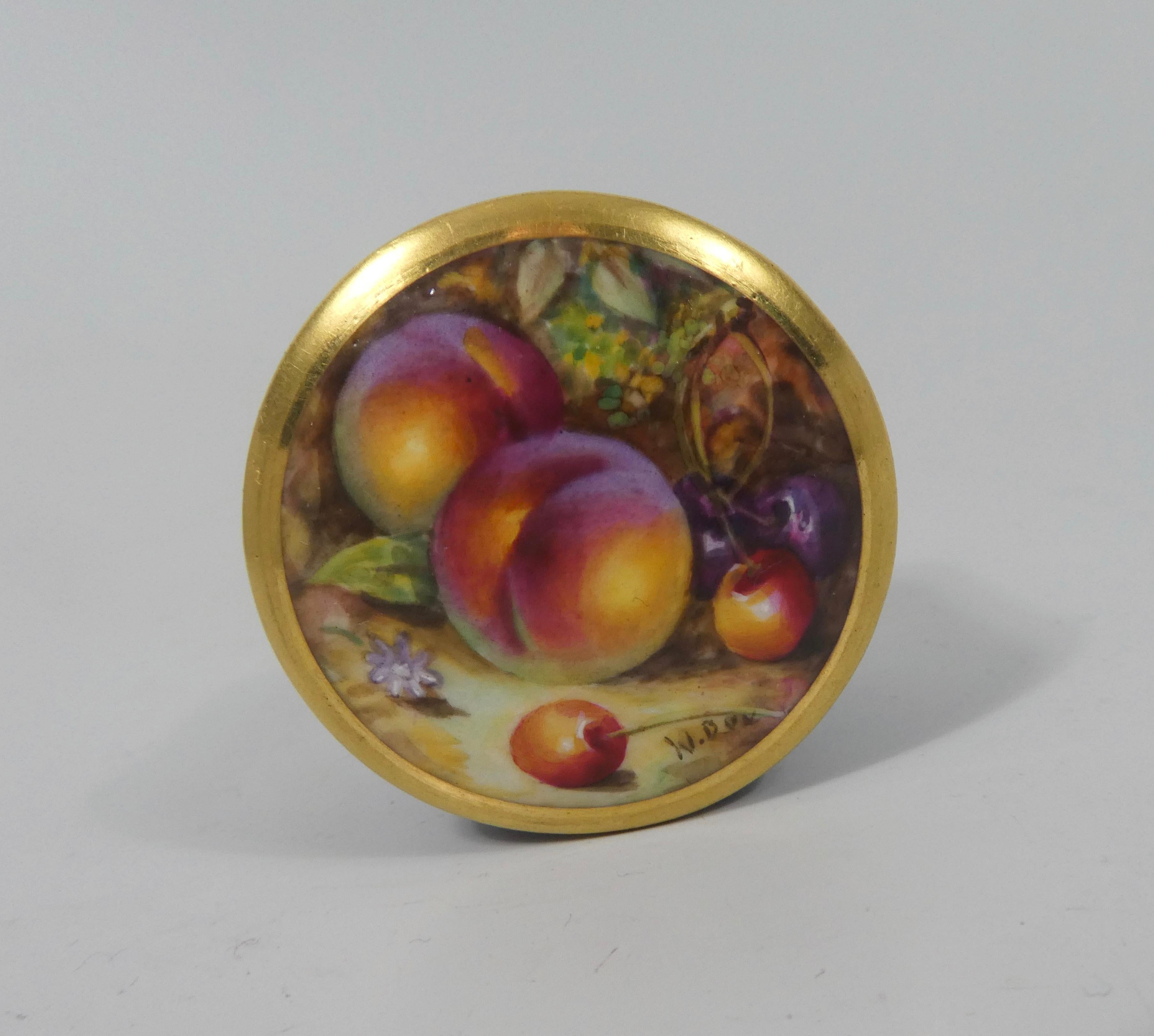 Royal Worcester porcelain pill box and cover, dated 1924. The powder blue ground circular box, having a cover, hand painted by William ‘Billy’ Bee, with a study of fruit, on a mossy bank.
Signed W. Bee.
Puce printed factory marks and date code for