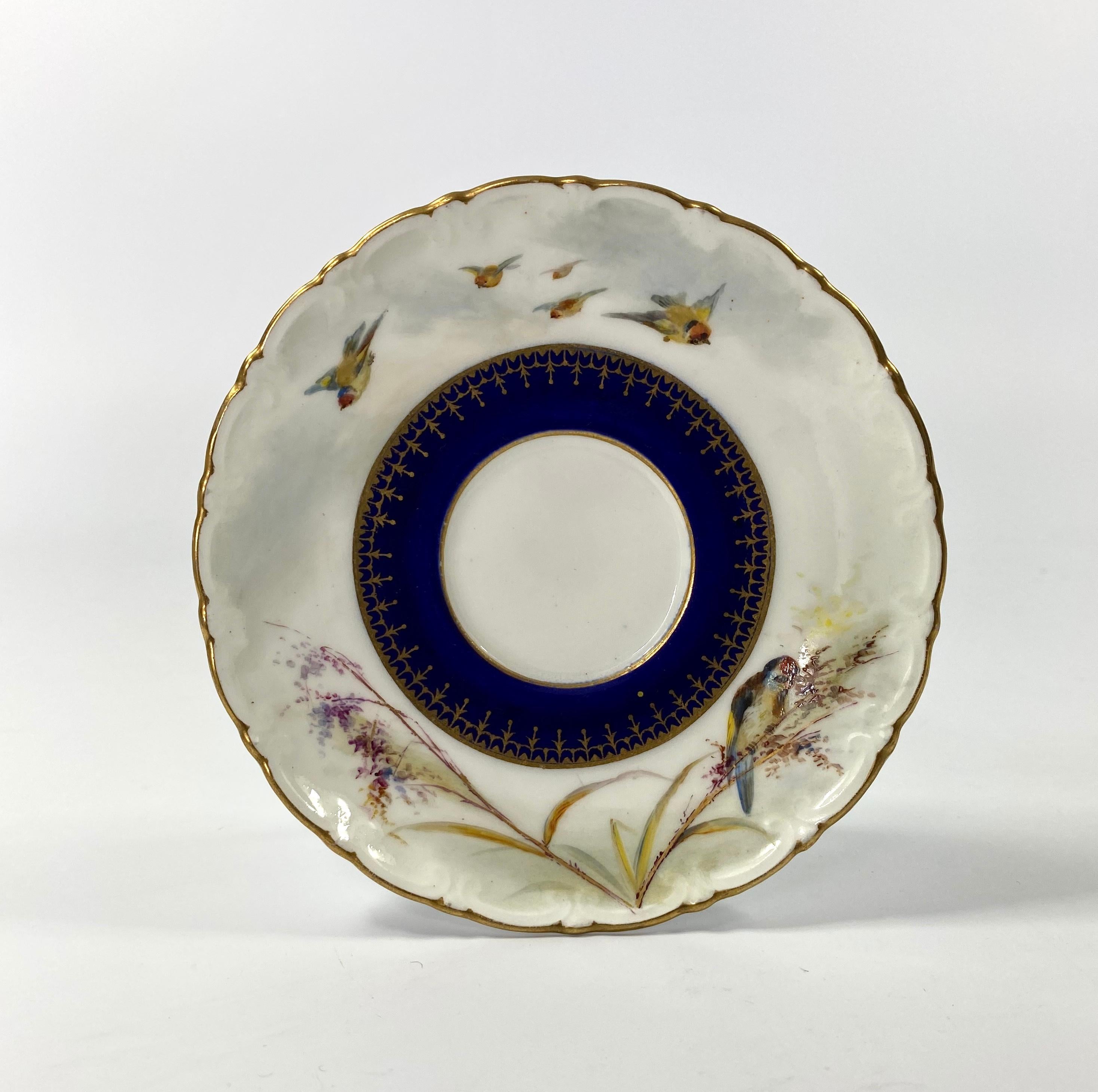 Royal China works Worcester porcelain cup and saucer, dated 1902. The scroll moulded cup finely painted with a large robin perched upon a flowering plant, whilst two other robins fly above. Having a gilt scroll moulded handle.
The scroll moulded