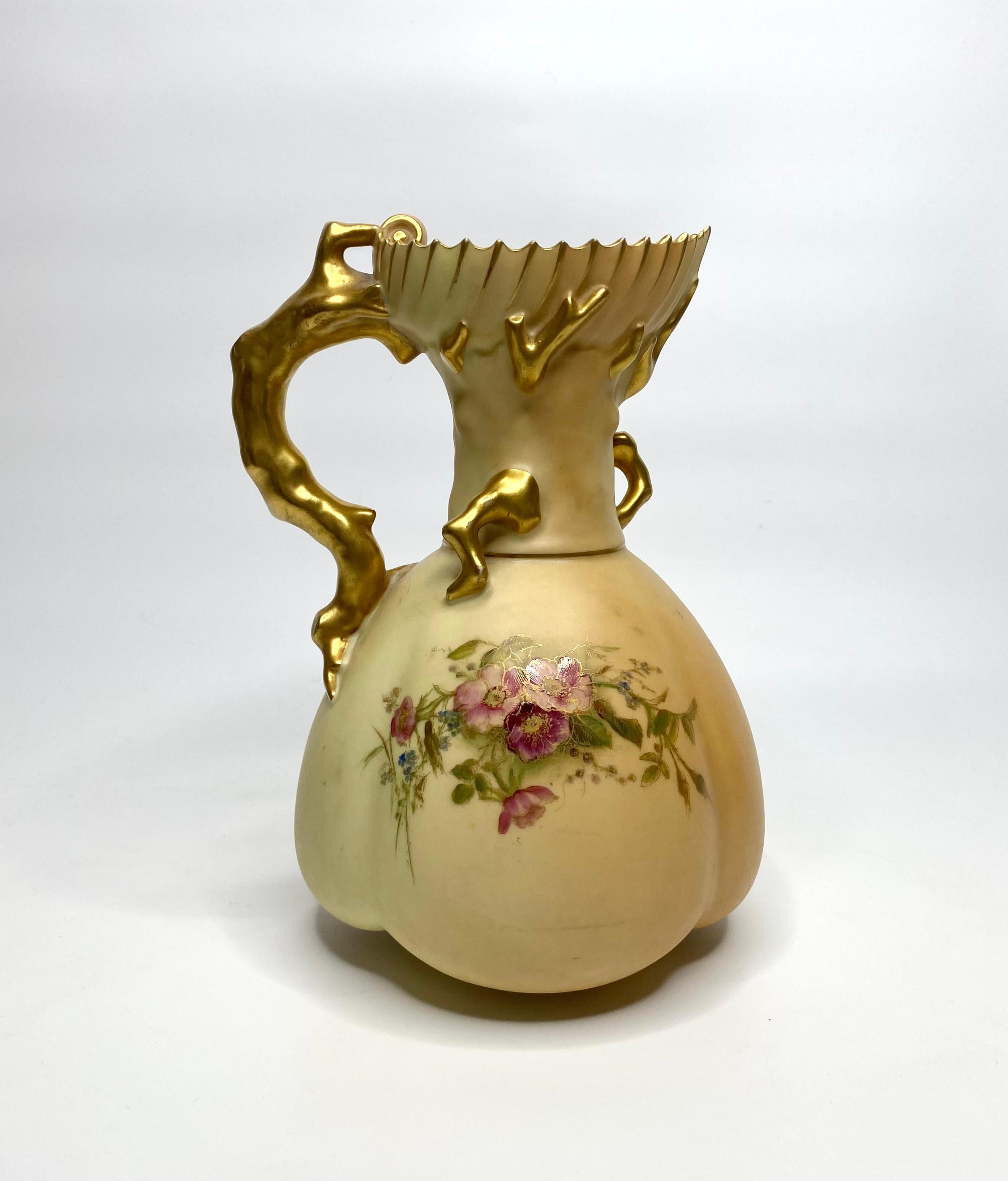 Royal Worcester porcelain jug, dated 1908. The melon shaped jug having a scallop rimmed top, and gilt branch handle. Painted and gilded with sprays of flowers, on a ‘Blush Ivory’ ground.
Printed puce factory mark, date mark for 1908, model number