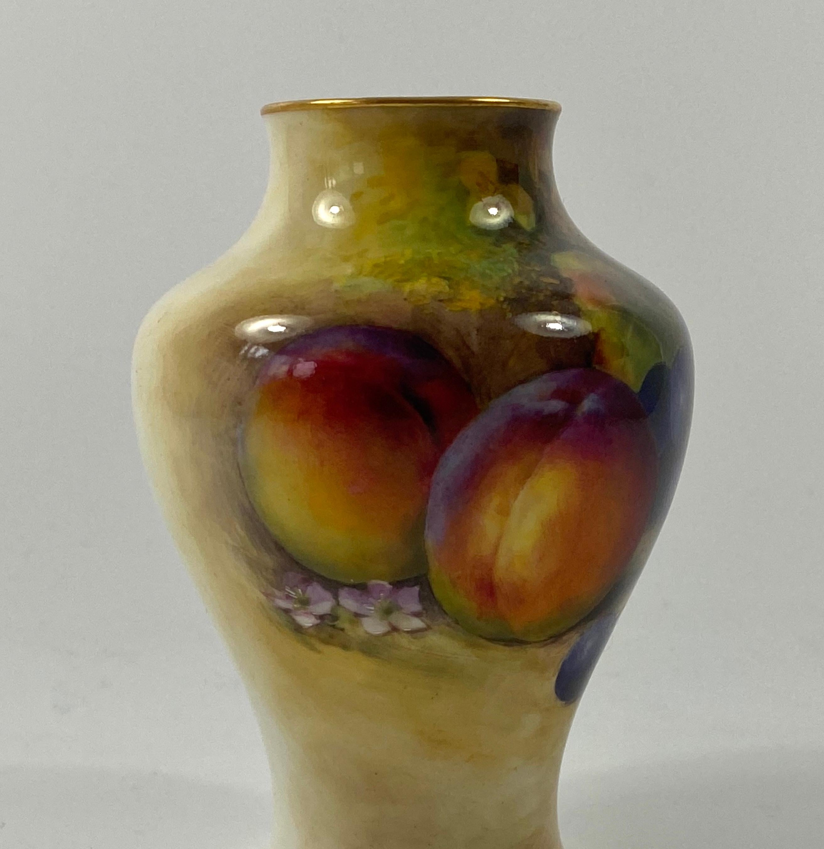 Royal Worcester porcelain vase, by Richard Sebright, dated 1933. Finely painted with a study of fruit on a mossy bank.
Having gilt rims.
Signed – R. Sebright.
Printed puce factory mark, and date code for 1933.

Measures: Height: 10.4 cm, 4