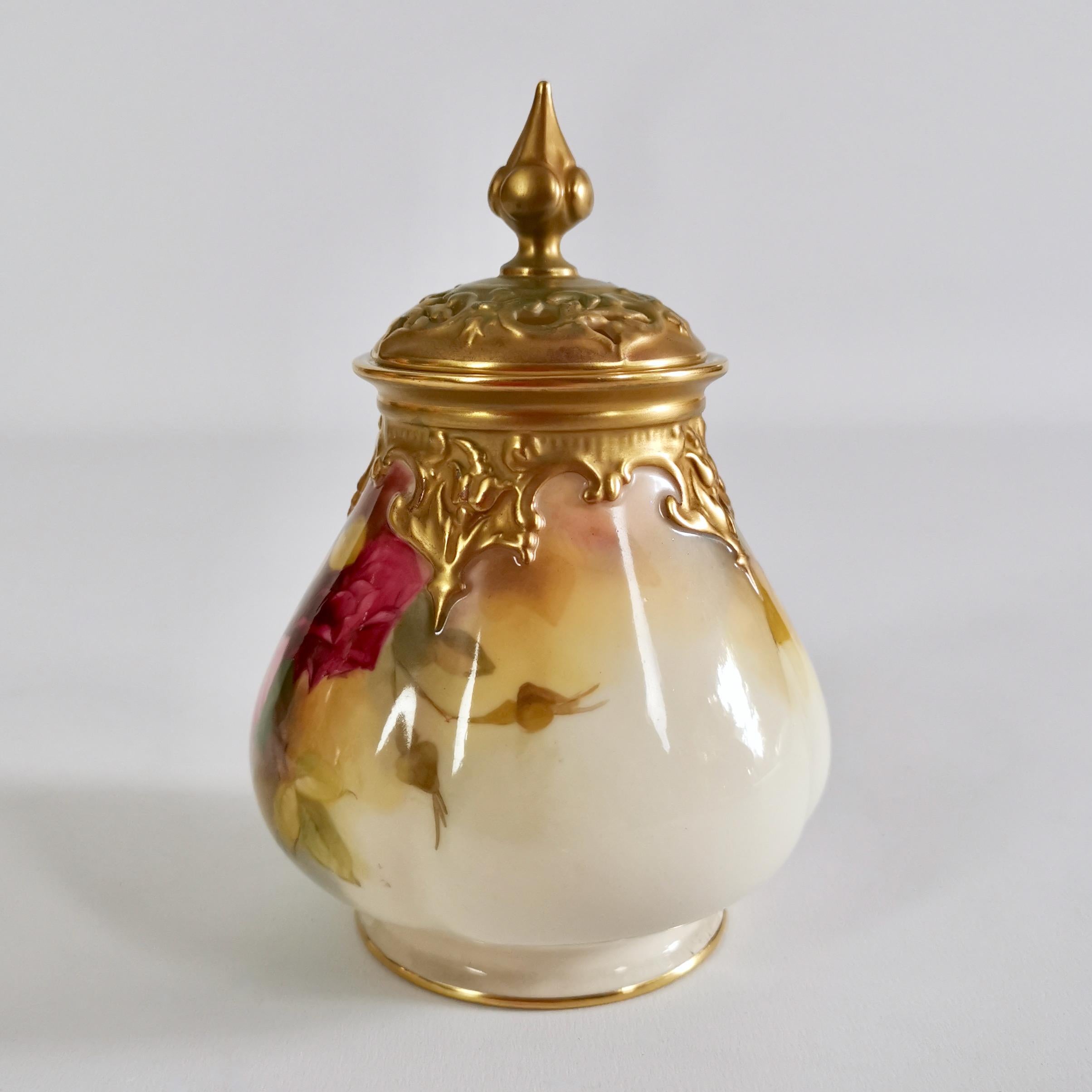 This is a very fine small potpourri vase and cover made by Royal Worcester in 1923. The urn has a blush ivory ground with exceptionally beautiful hand painted Hadley roses.

Potpourri vases were meant to hold a mix of scented dried flowers and