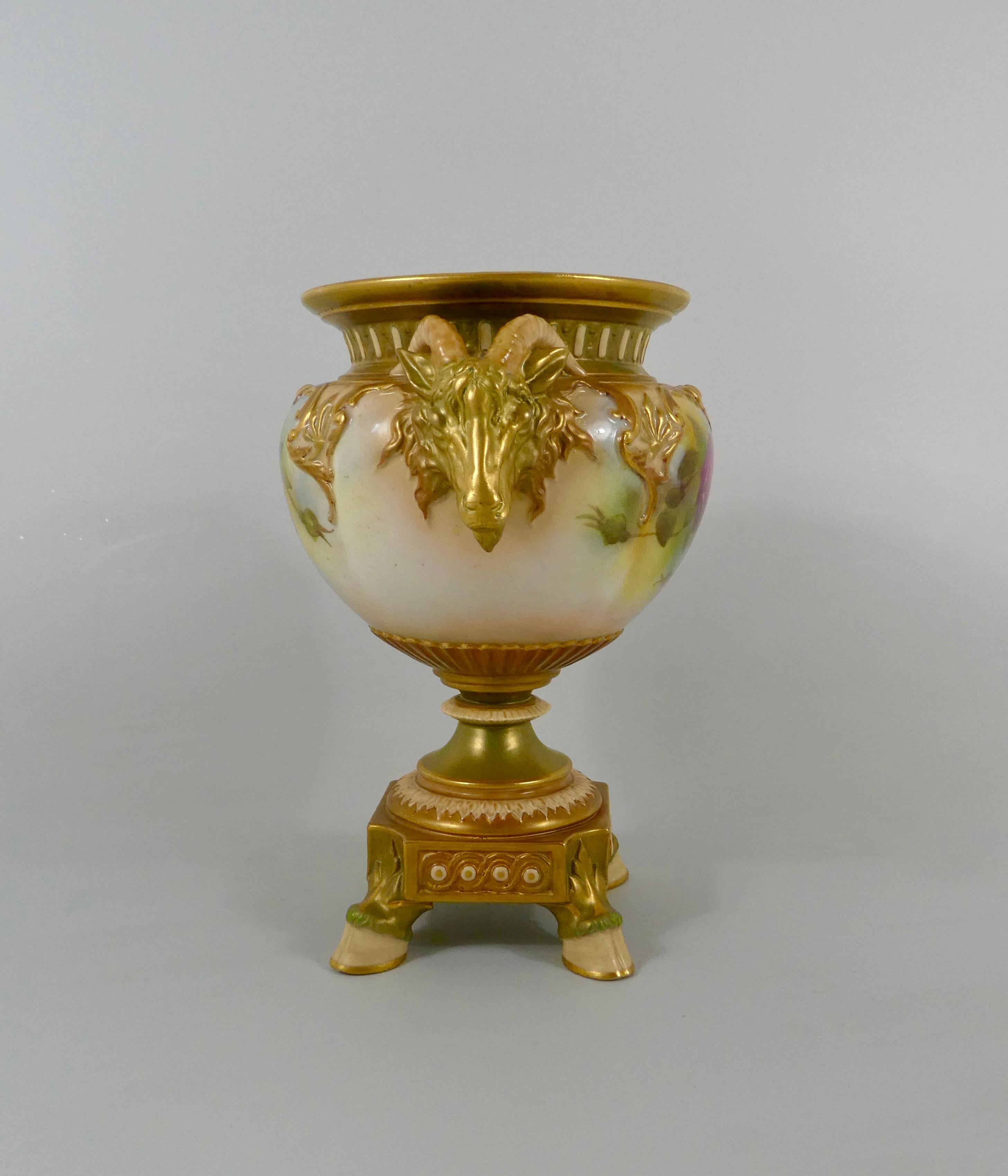 Royal Worcester porcelain vase, dated 1917. The melon shaped body, painted with sprays of roses, within gilt scroll moulded borders. Having large gilt ram's head handles, and set upon a canted square base, supported by four hoof feet.
Printed puce