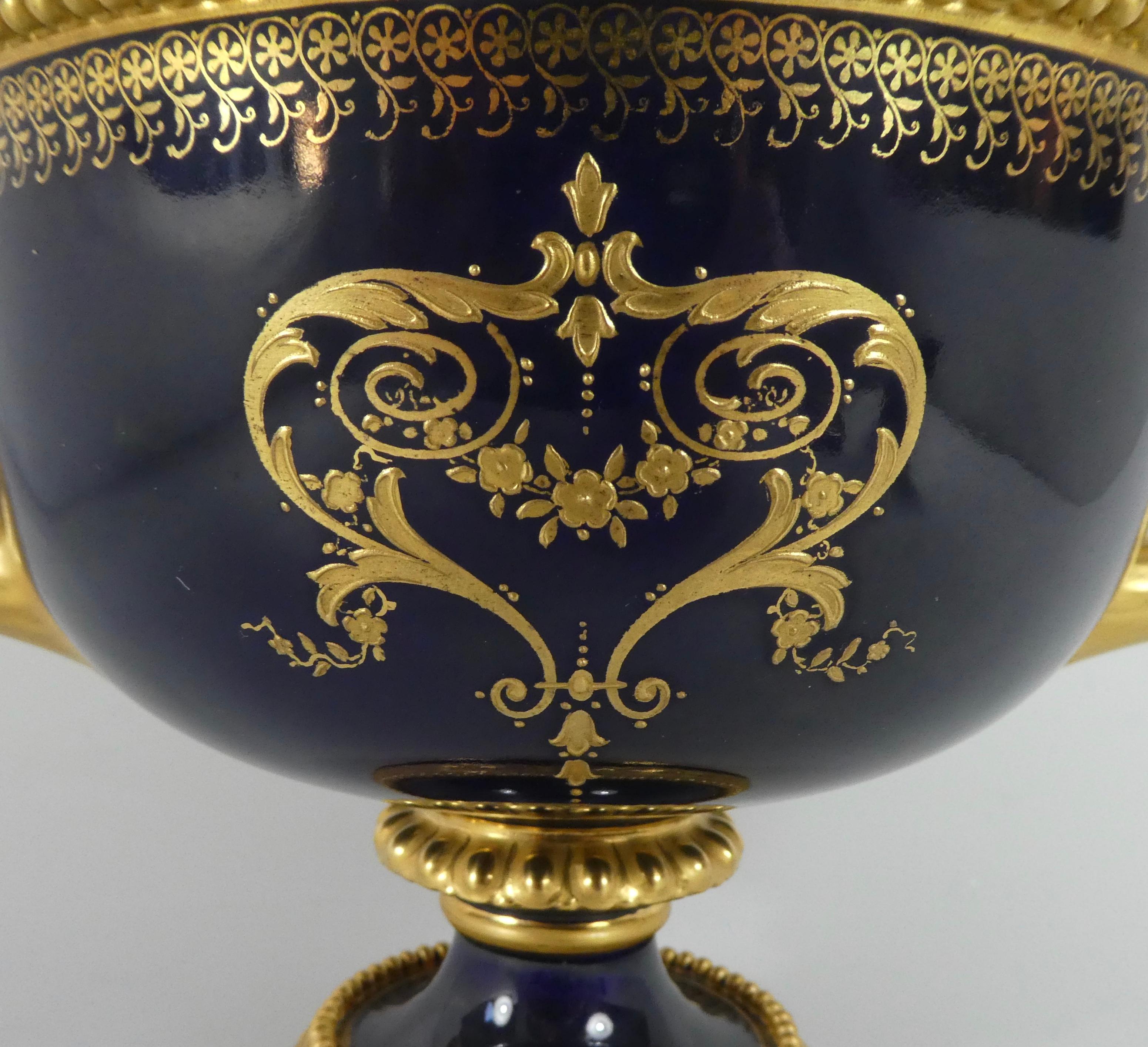 Porcelain Royal Worcester porcelain ‘Warwick Vase’, painted by Harry Davis, dated 1925.