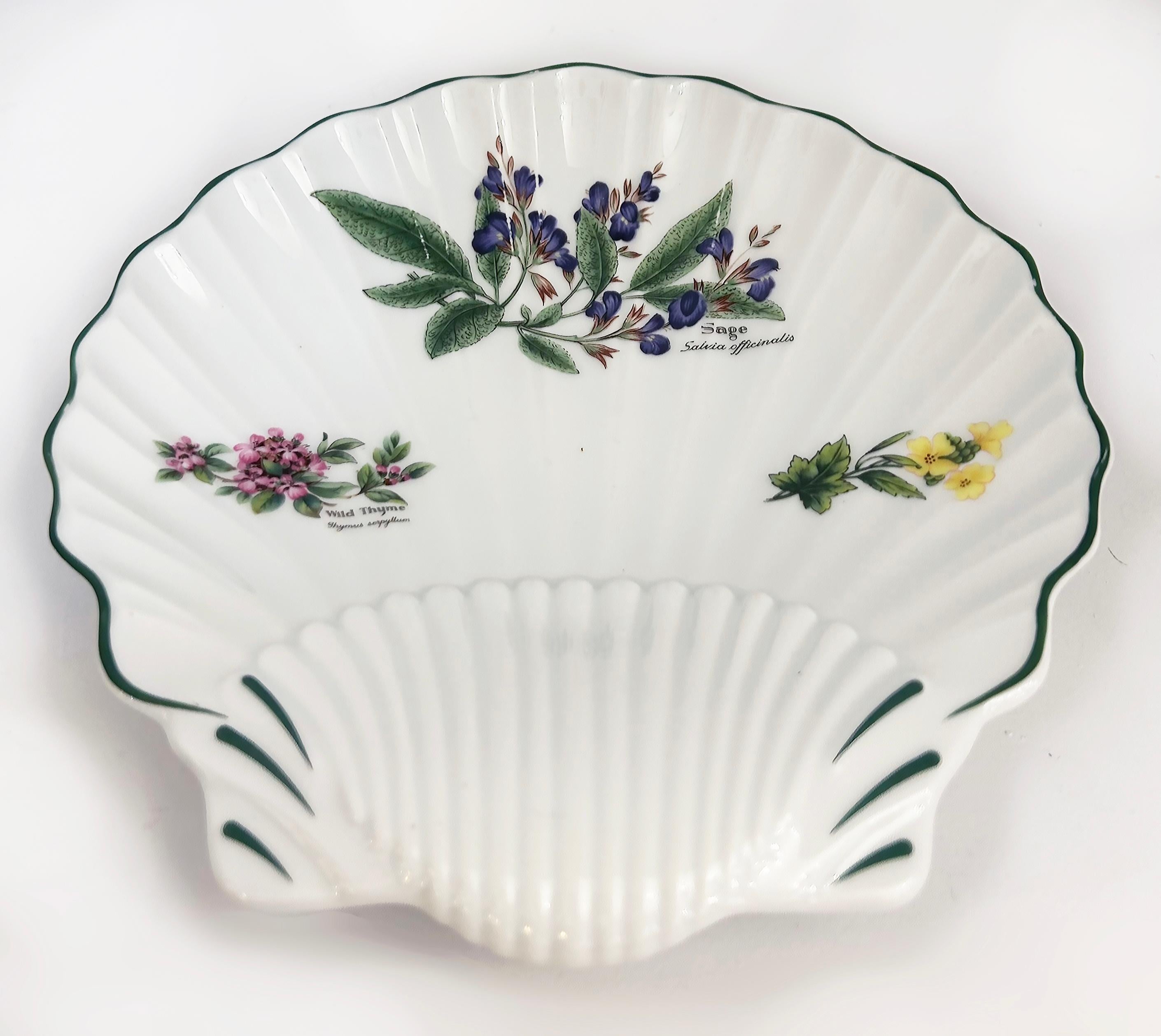 Royal Worcester Porcelain Wild Thyme Sage Plates Pair, England 

Offered for sale is a pair of Royal Worcester fine porcelain decorative scalloped edge shell plates from the 