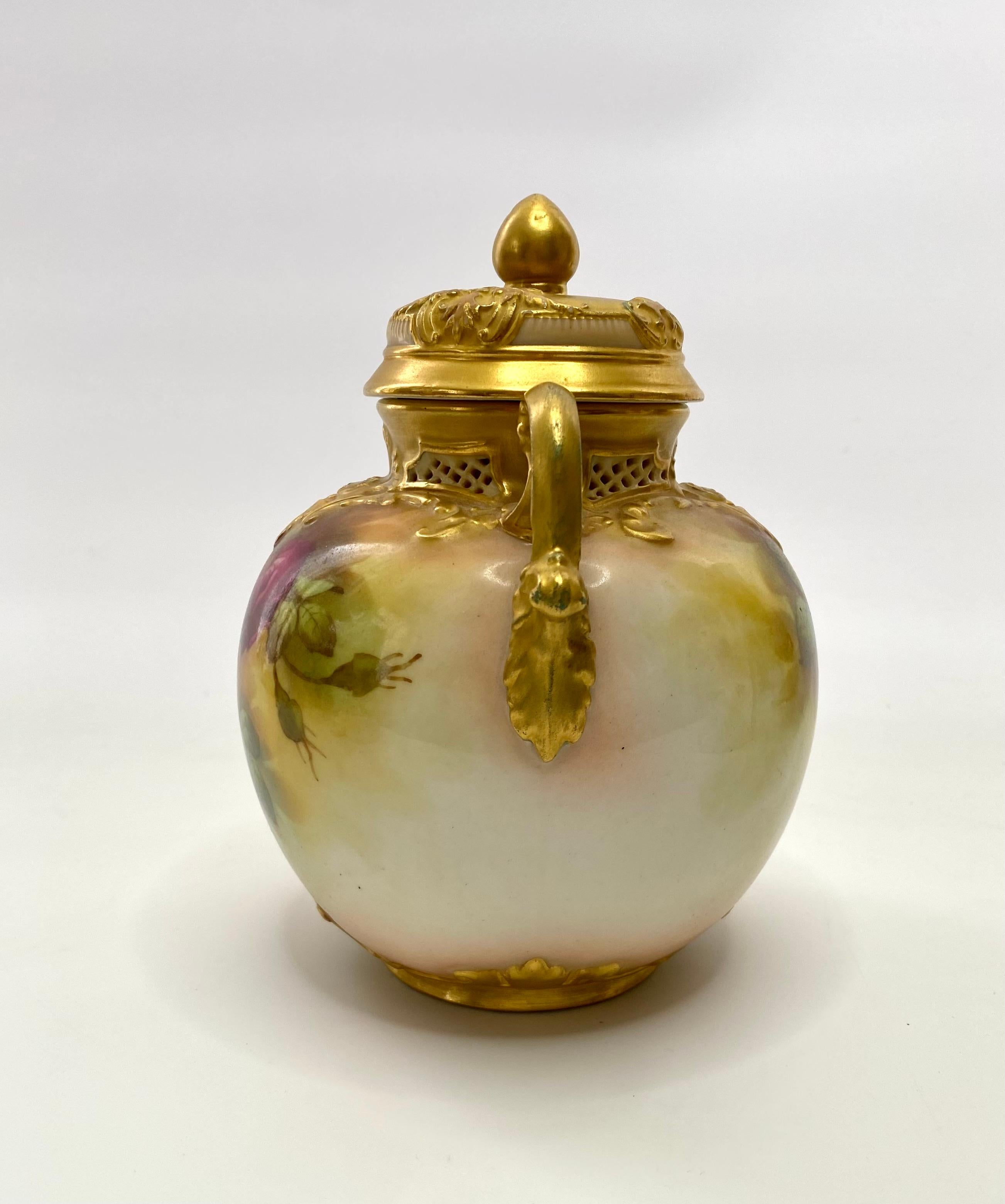 Royal Worcester porcelain pot pourri and cover, F. Harper, dated 1919. The globular pot pourri moulded with scroll work, framing a pierced gallery, and having twin gilt scroll handles.
Hand painted to both sides, with a study of roses, signed by