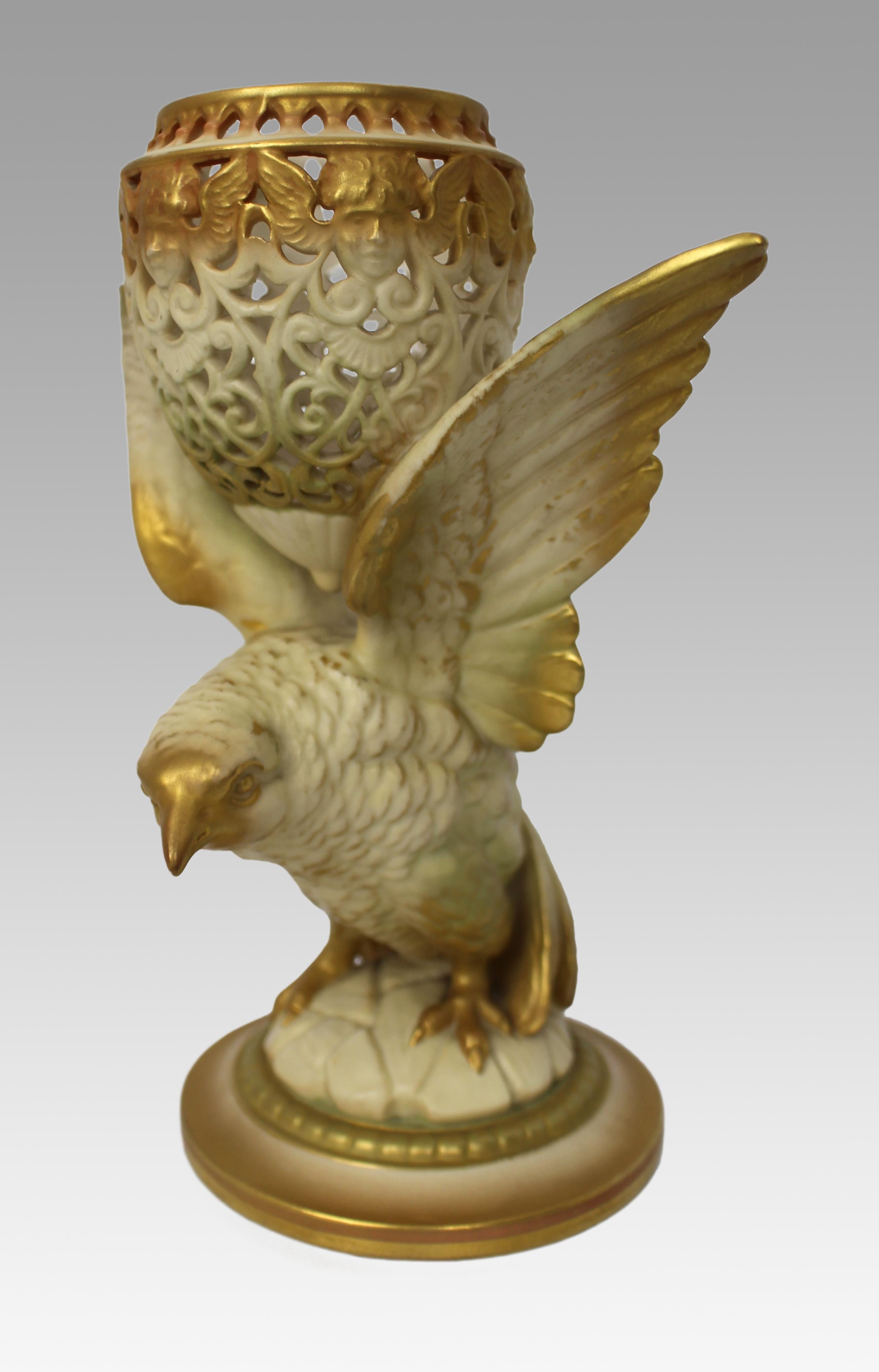 Royal Worcester Reticulated Pot Pourri Vase, Model G11, England, 1923

A rare and finely modelled Royal Worcester porcelain pot pourri vase, dated 1923. Designed as a stylised bird with wings outstretched, perched upon a rocky base and supporting a