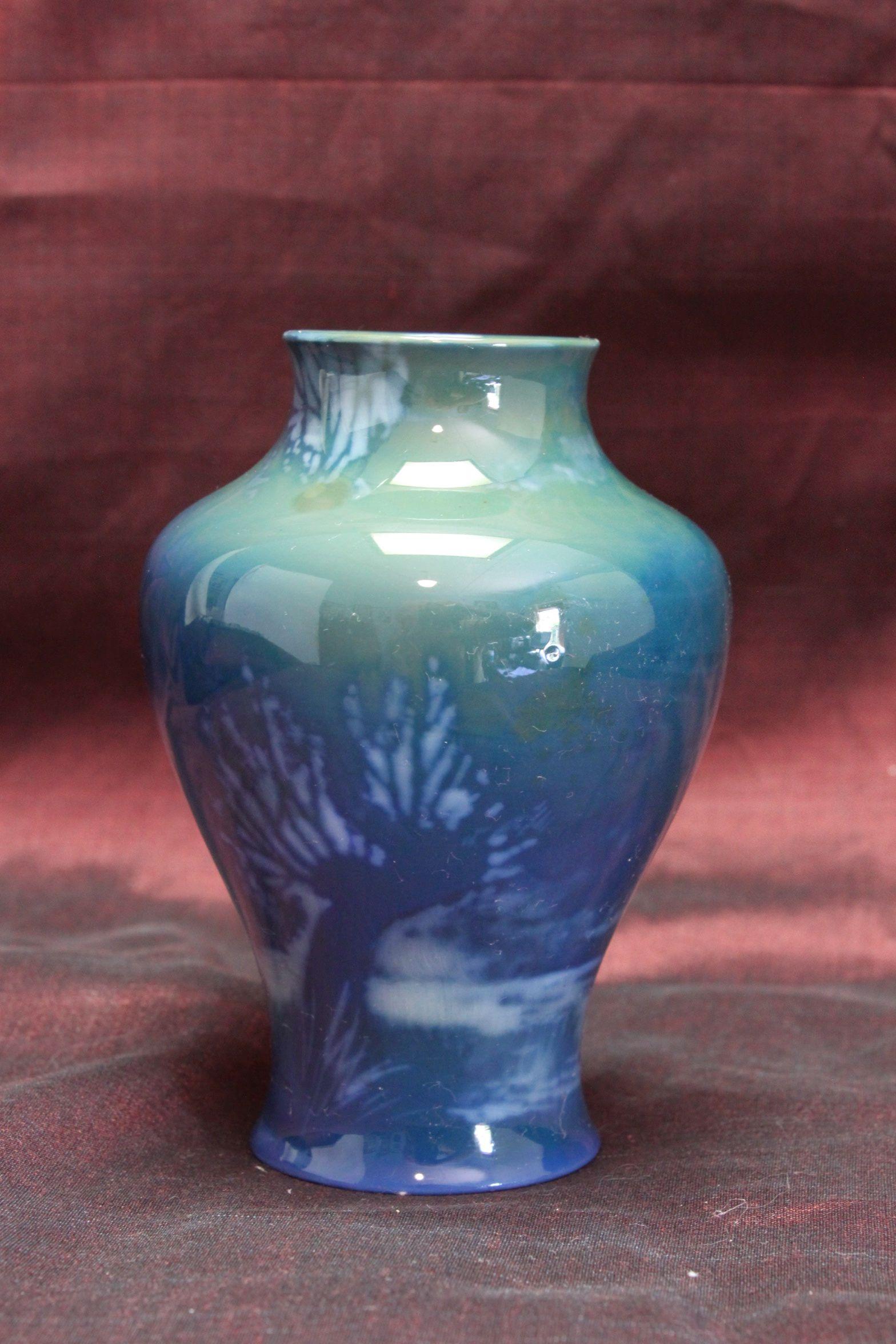 This small baluster shaped vase is by Royal Worcester and is from their Sabrina Ware range. The vase is hand painted by Walter Sedgley who was at the Worcester factory from 1889 until 1929 and was one of their principal painters for many years. The