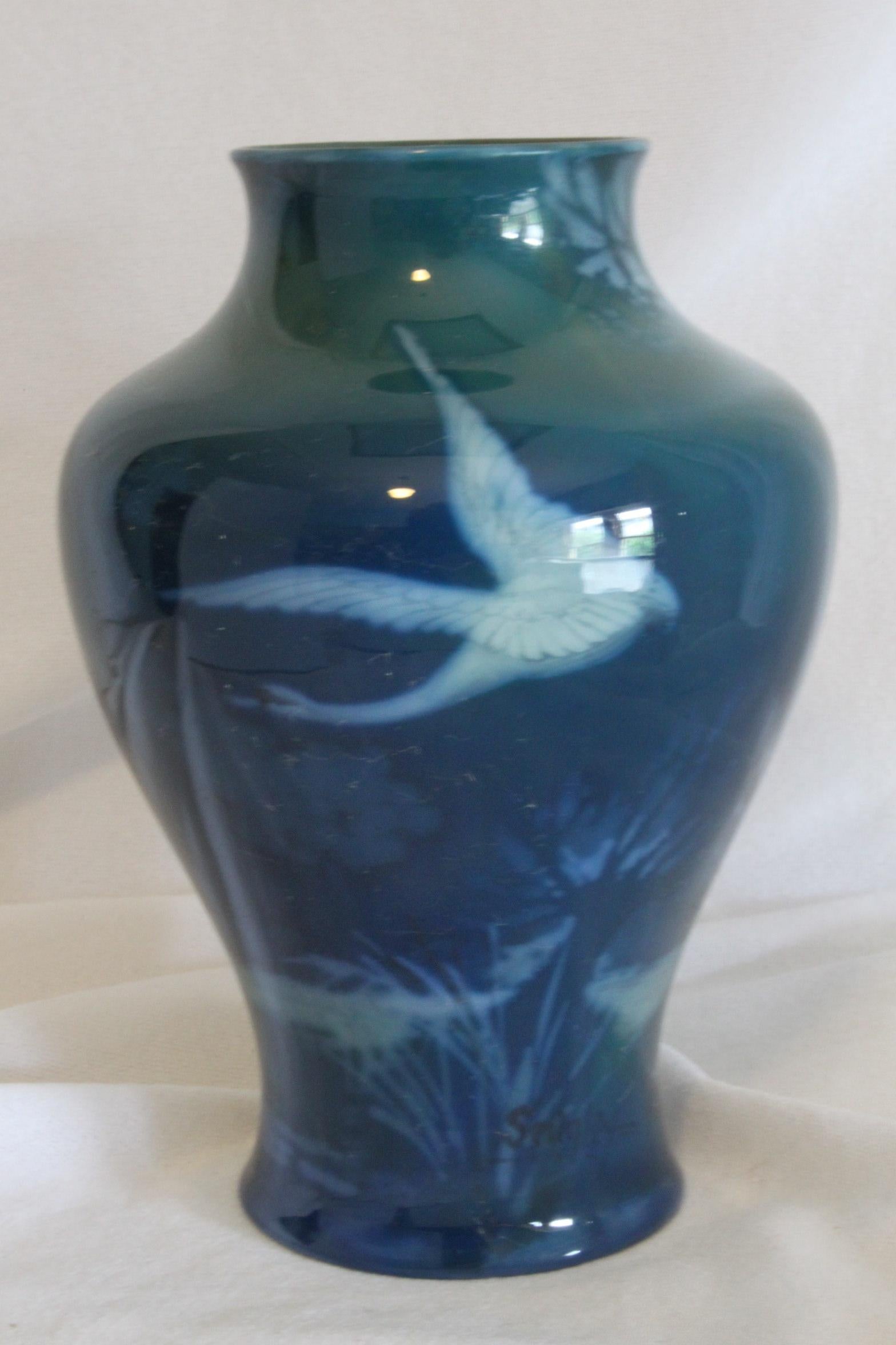 This small baluster shaped vase is by Royal Worcester and is from their Sabrina Ware range. The vase is hand painted by Walter Sedgley who was at the Worcester factory from 1889 until 1929 and was one of their principal painters for many years. The