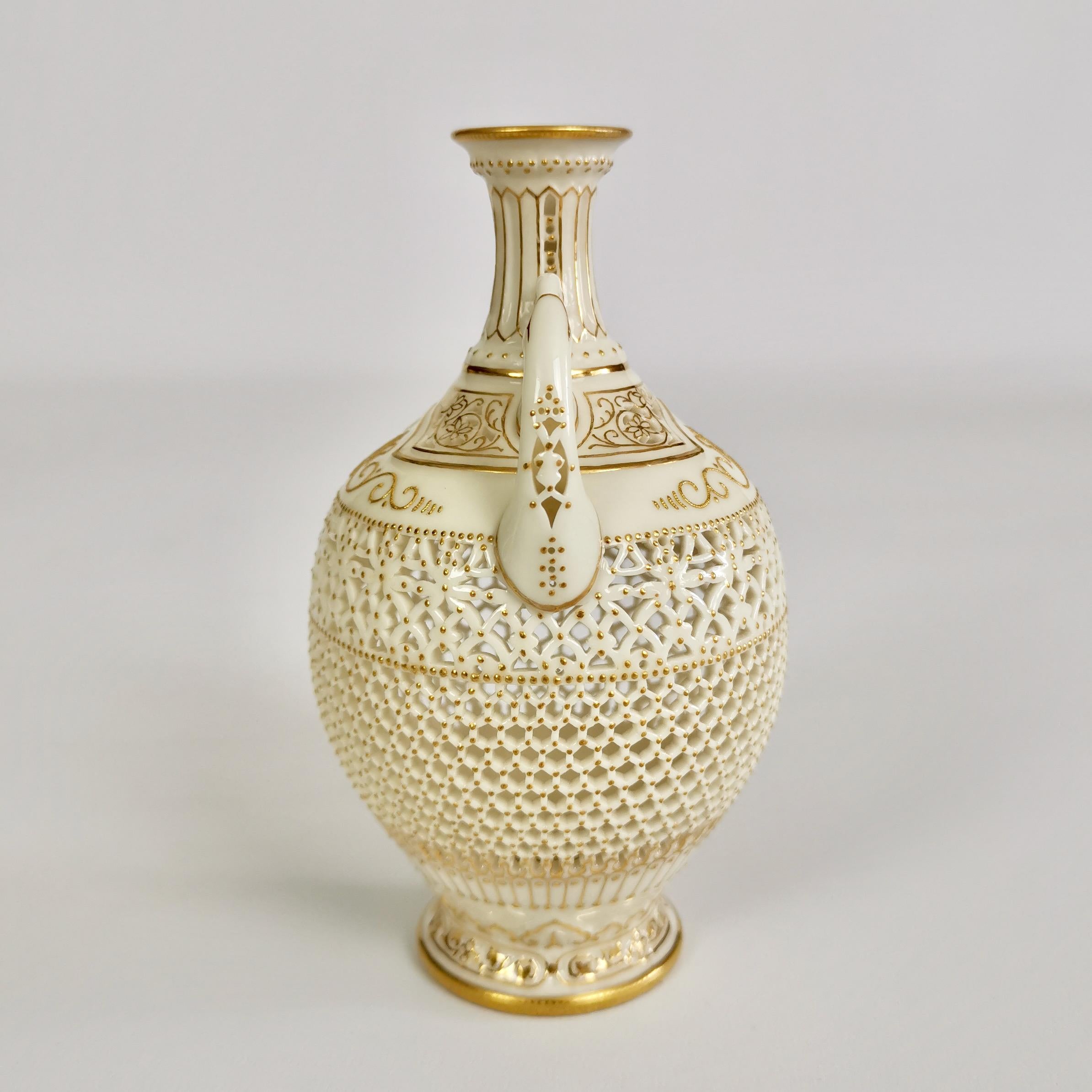 This is an important and sublimely made little vase created by George Owen at Royal Worcester in the year 1917. The vase is in the Persian style and is delicately reticulated (pierced) with very fine raised gilt patterns.

The original Worcester