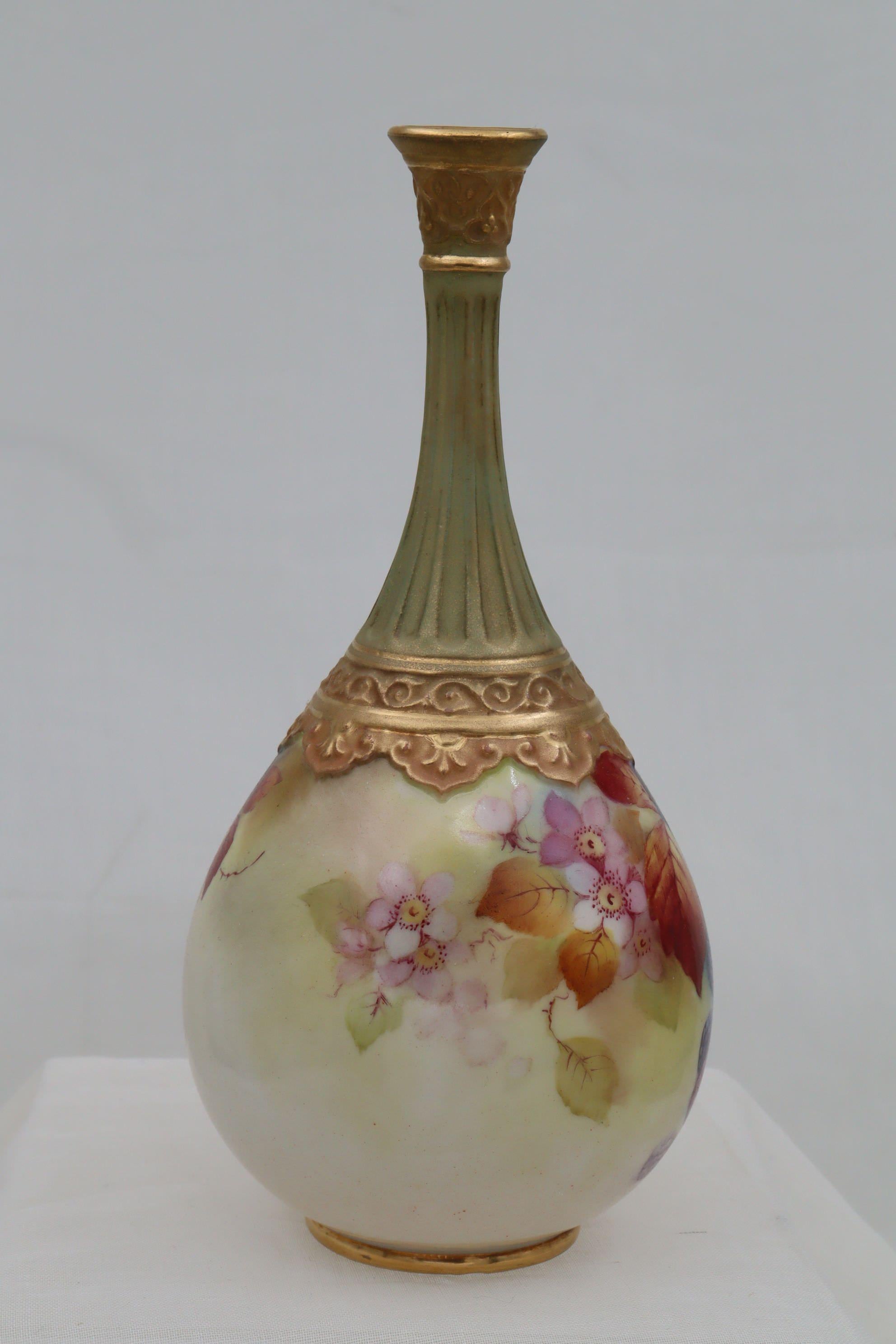 This Royal Worcester pear shaped vase with decorative gold mounts, was hand painted by Kitty Blake, with her signature motif of blackberries and autumnal leaves.  Kitty Blake worked at the Royal Worcester factory for 48 years from 1905 to 1953,