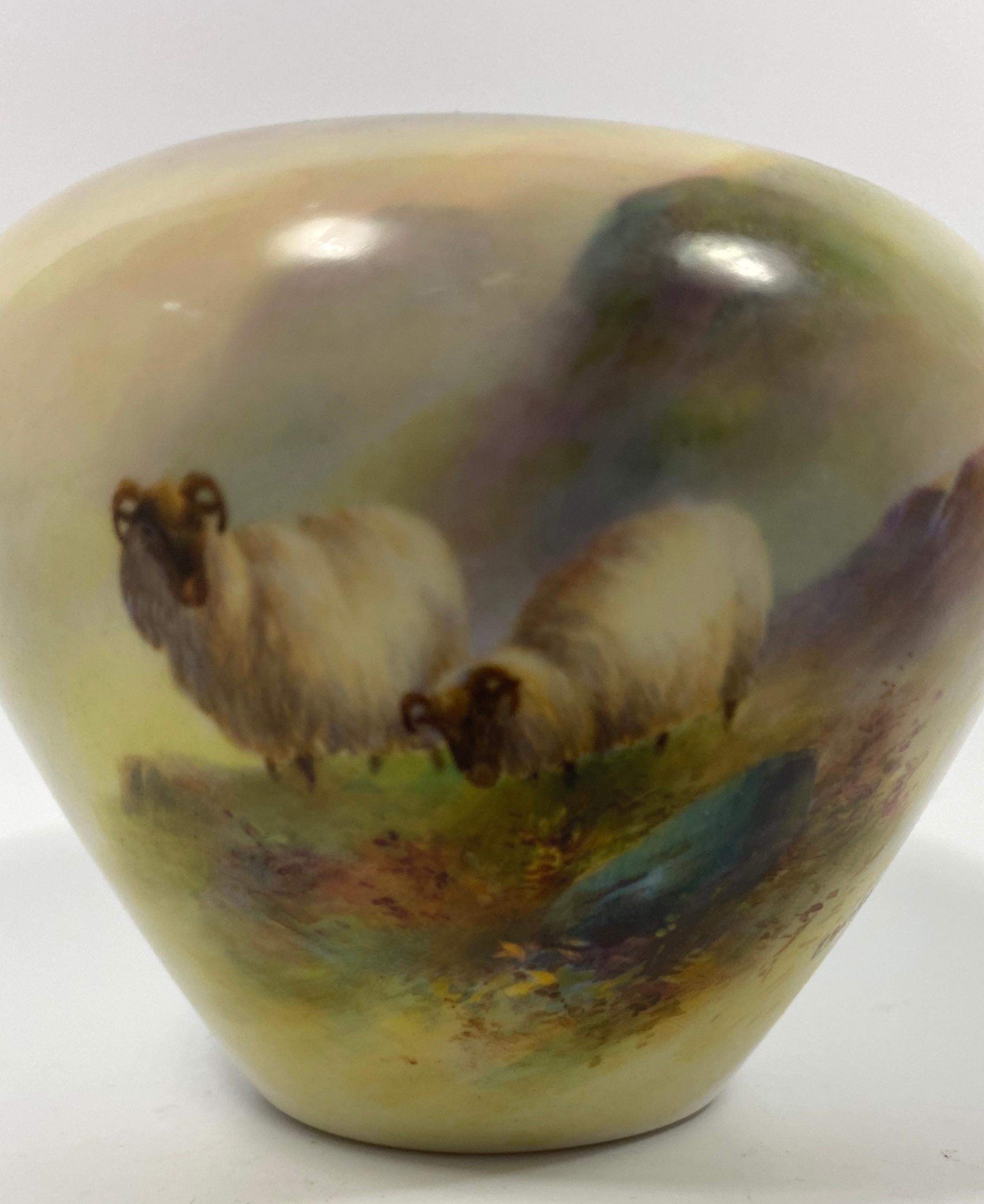 Royal Worcester porcelain vase, dated 1911. Beautifully hand painted by Ernest Barker, with two sheep, in a Highland setting.
Signed E. Barker.
Printed green factory marks and model number to the base.
Measures: Height - 6.5 cm,2 1/2”.
Diameter