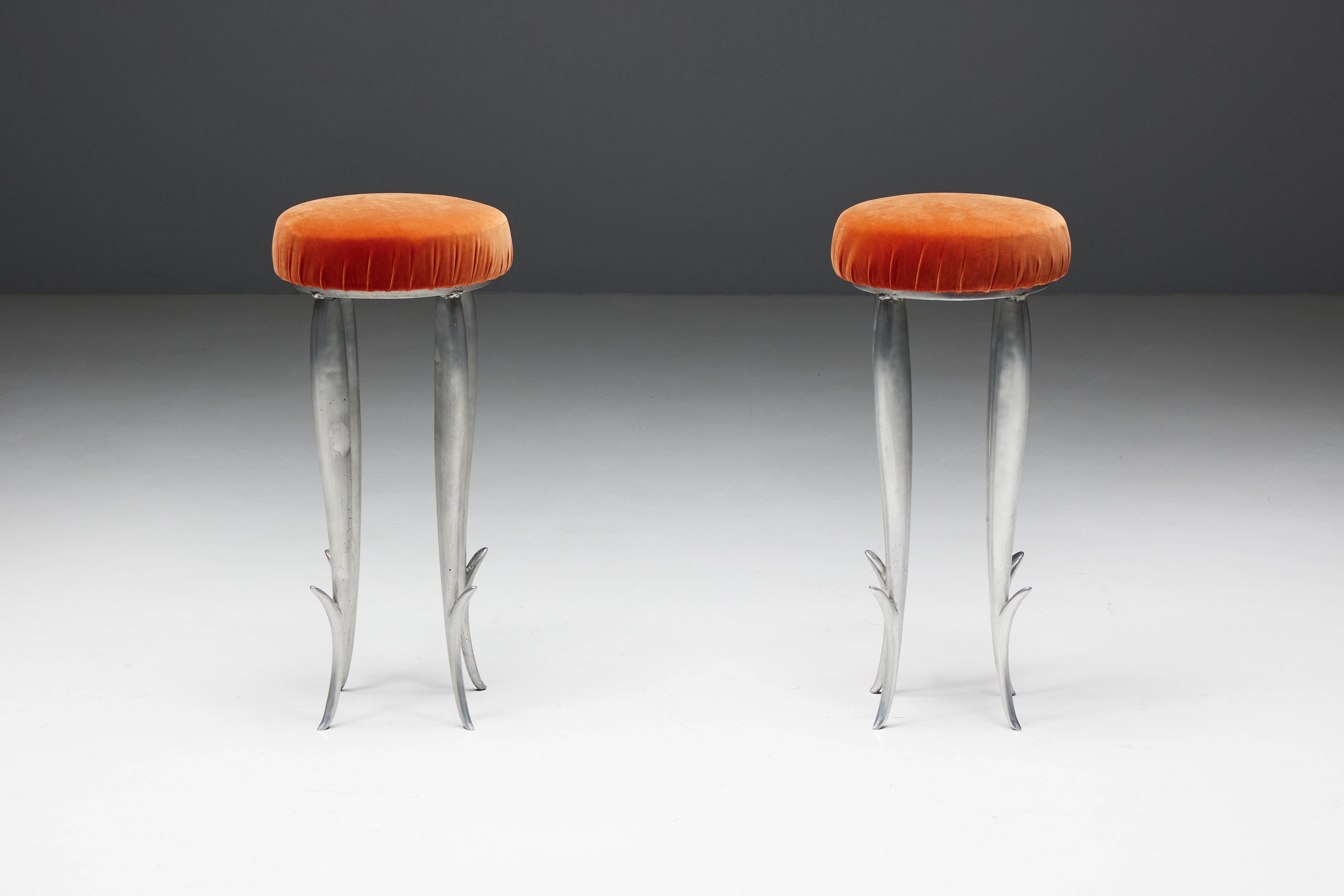 Royalton bar stools by Philippe Starck for XO, originally designed for the famous Royalton Hotel in New York. These stools embody the visionary style of acclaimed French designer Philippe Starck. Each stool has a sturdy cast aluminum base and the