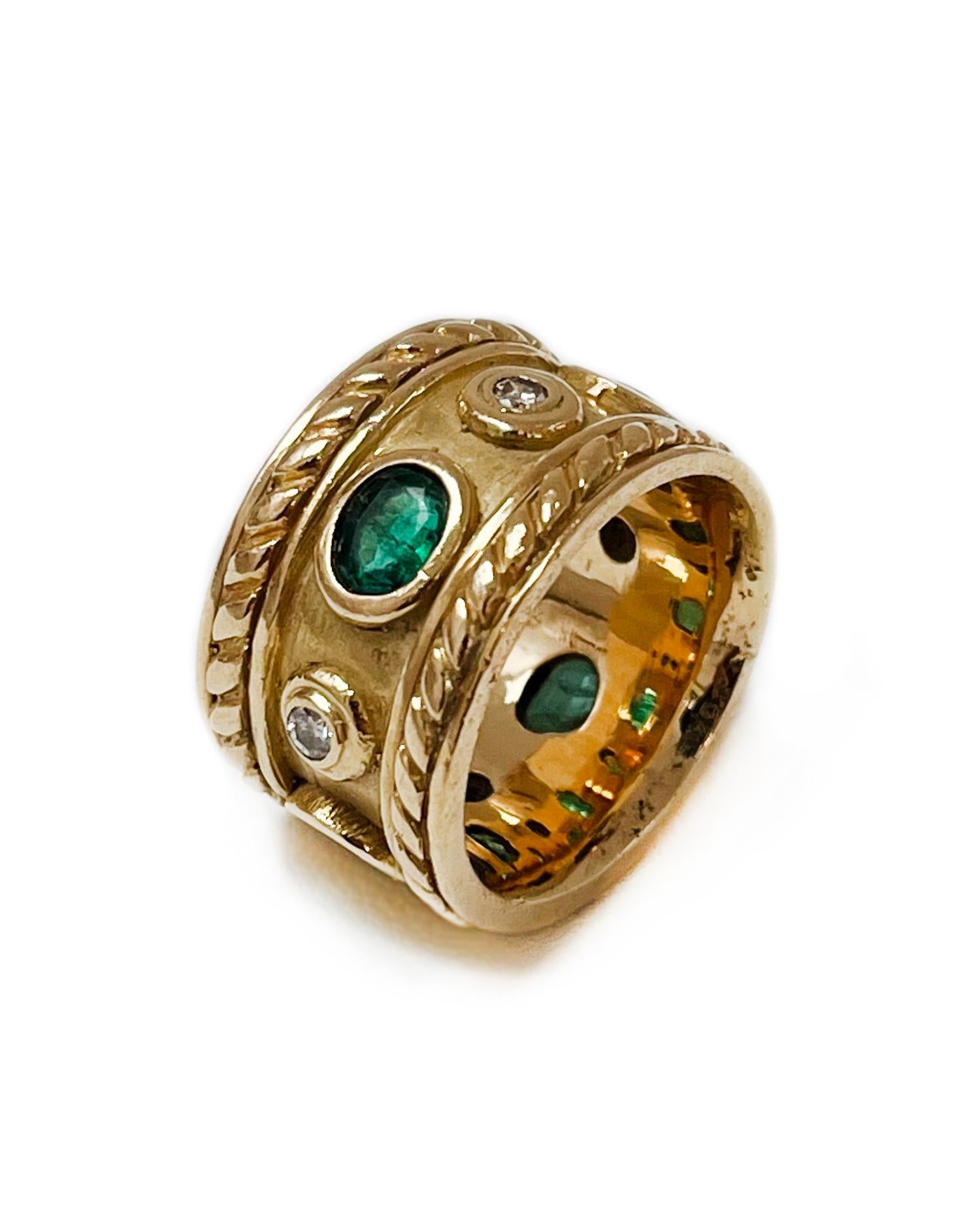 Intention: Find your power

Dorian's Find: This vintage find is commanding, and exudes power and strength. A detailed band ring in 14k yellow gold with a rope pattern around each side, and alternating emeralds and diamonds around the center. 

Style