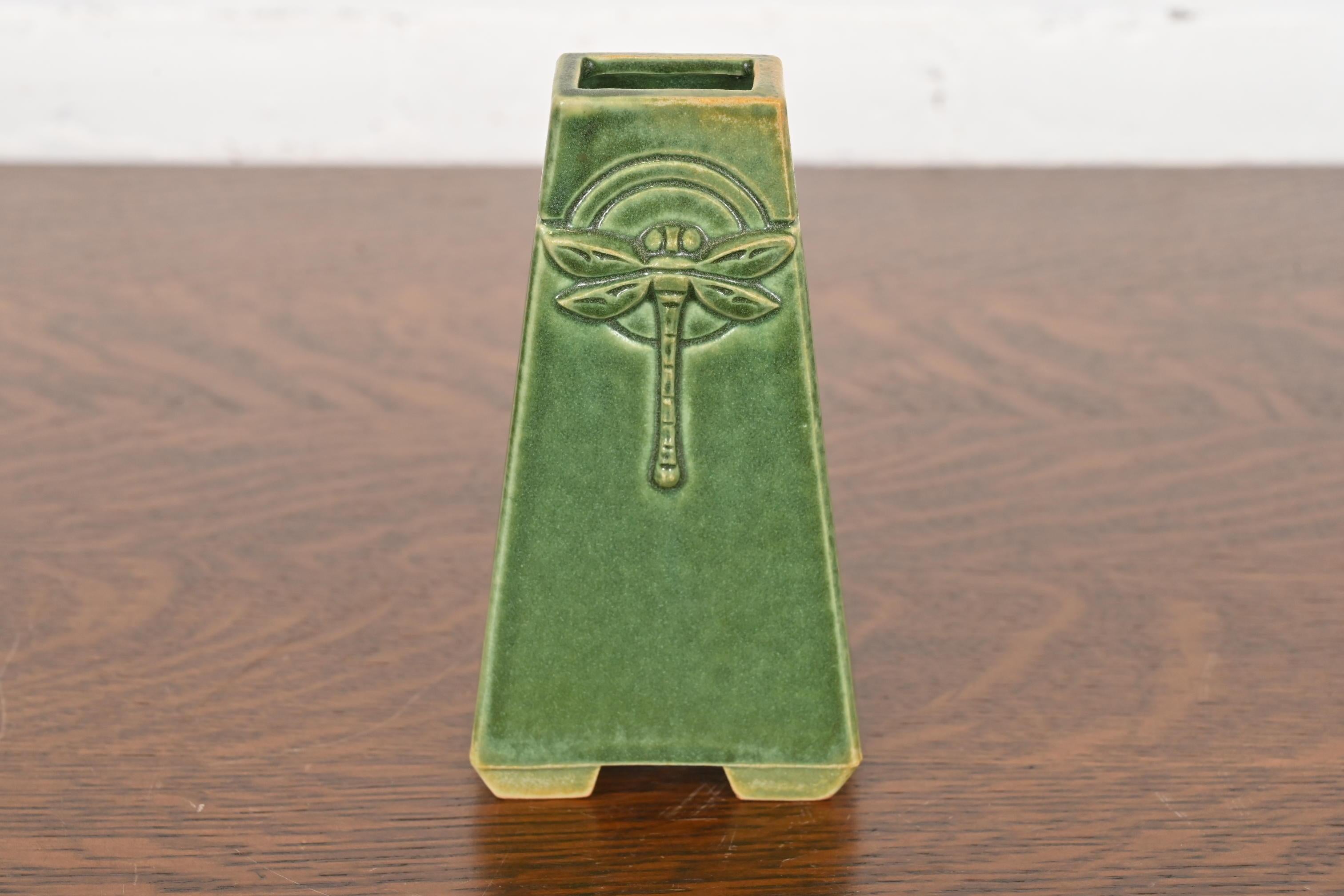 A gorgeous Arts & Crafts glazed art pottery vase with dragonfly motif

By Roycroft Pottery

USA, Circa Late 20th Century

Glazed ceramic in a beautiful green color.

Measures: 3.25