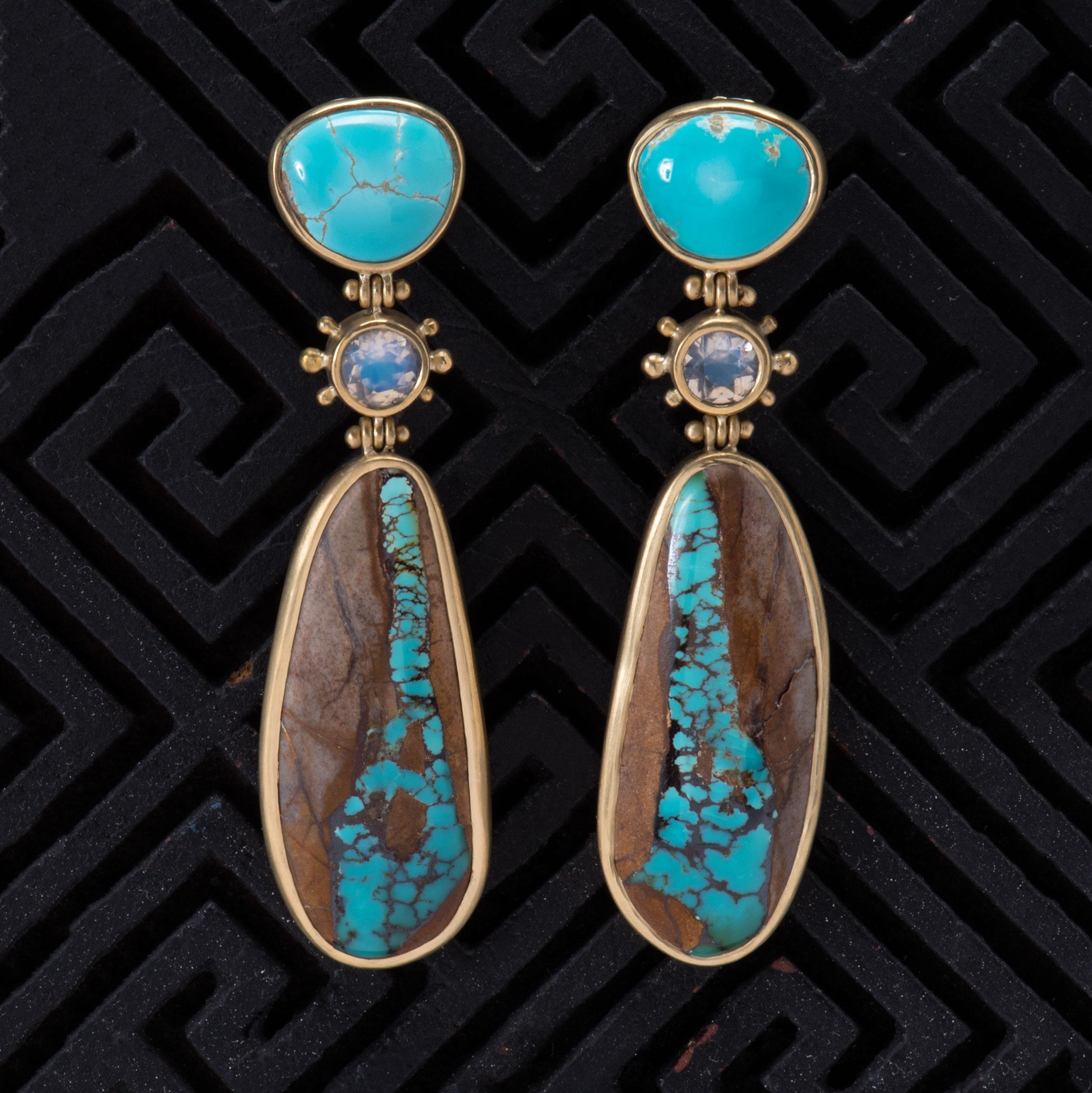 Blue Royston Turquoise Tops, faceted moonstones in beaded bezel settings and large brown matrix Royston cabochons are handcrafted with natural stones from Nevada and set in 18k gold. These Southwest style earrings are hinged above and below the
