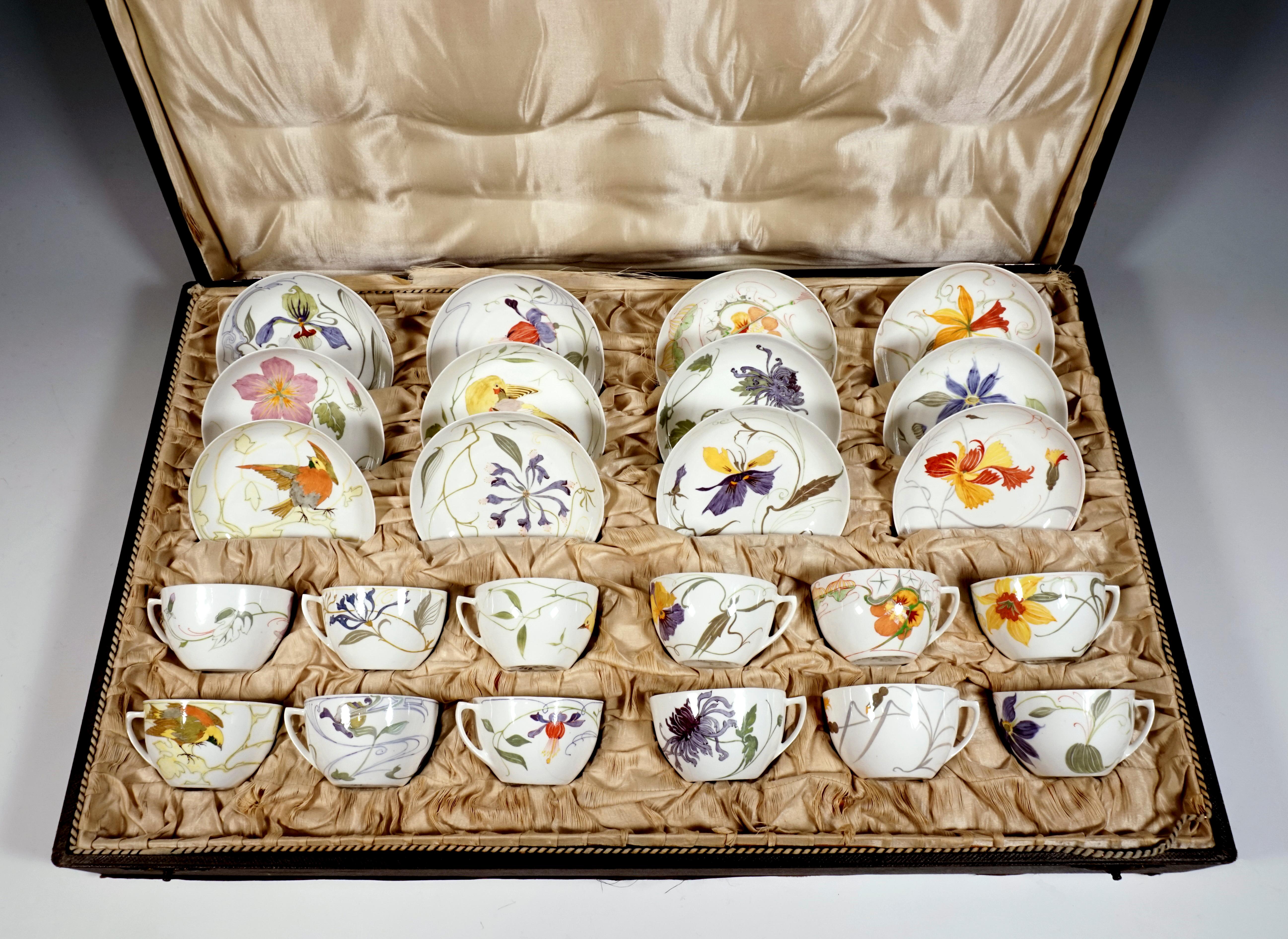 Twelve cups with saucers made of the finest eggshell porcelain, whitish shards, colored decor with an exceptionally large spectrum of floral motifs and birds in the Art Nouveau style, in the original case.

Manufactory Rozenburg
Founded in