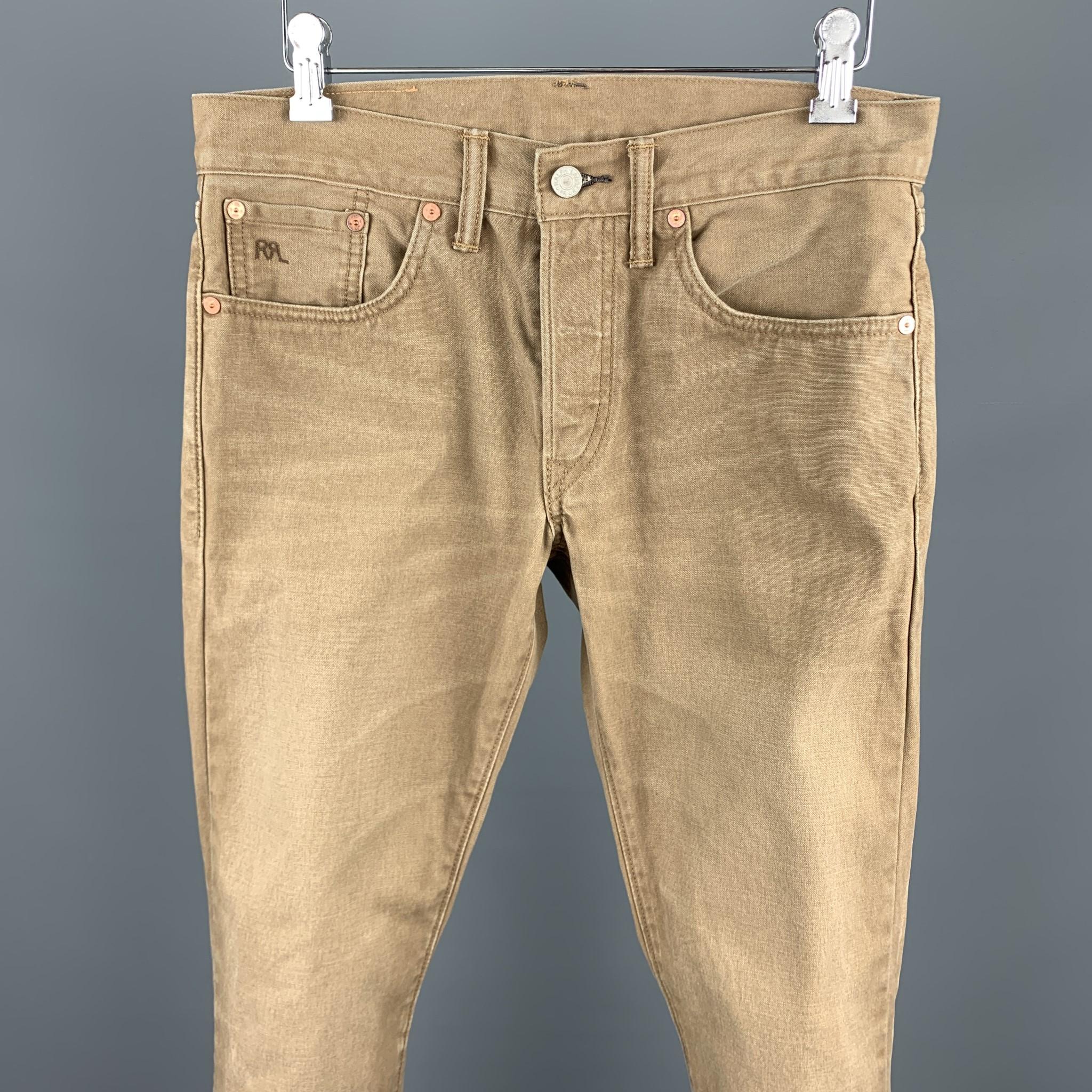 RRL by RALPH LAUREN casual pants comes in a tan cotton featuring a jean cut style, contrast stitching, and a zip fly closure.

Good Pre-Owned Condition.
Marked: 29x32

Measurements:

Waist: 30 in. 
Rise: 7.5 in. 
Inseam: 29 in. 