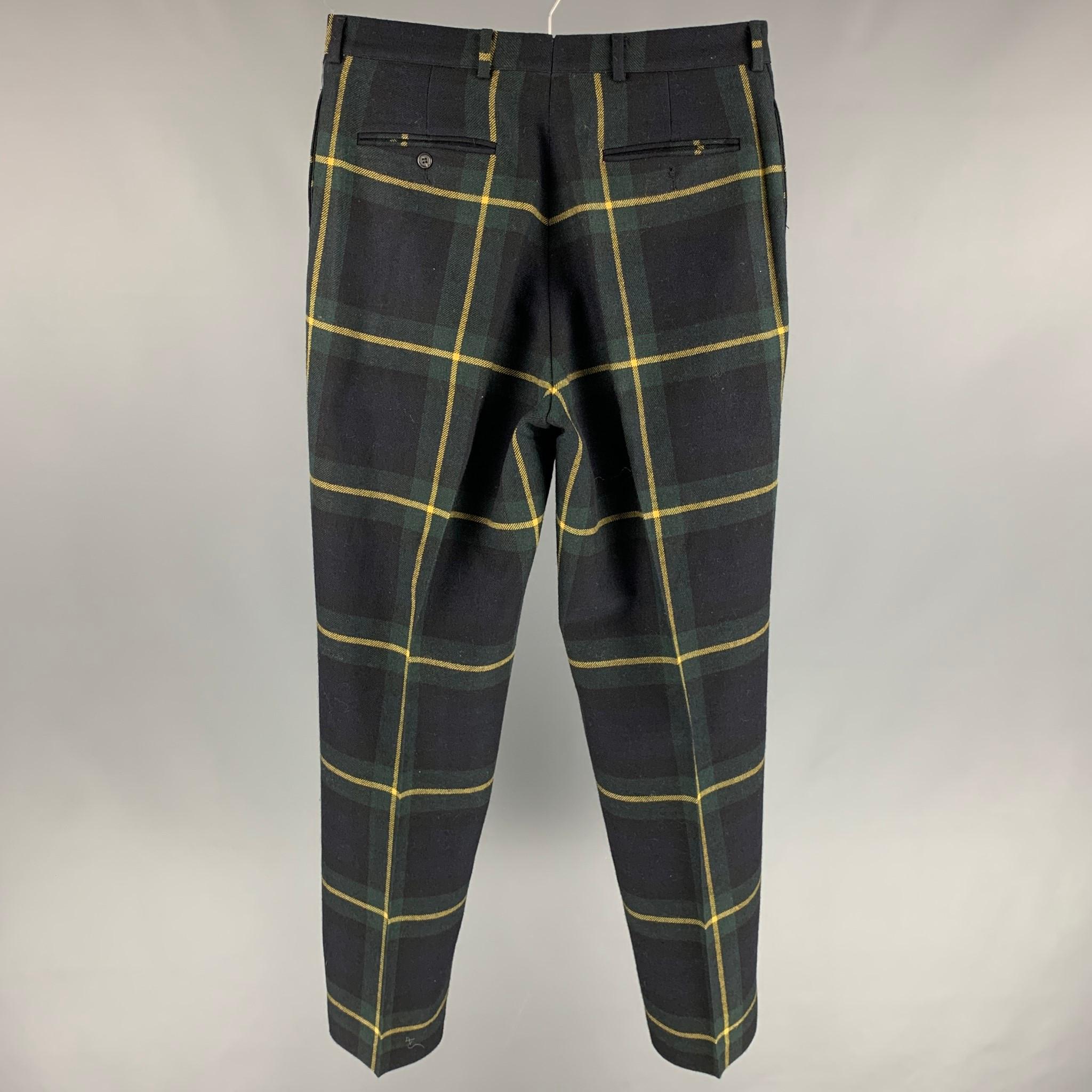 RRL by RALPH LAUREN dress pants comes in a navy & black plaid wool featuring a flat front, straight leg, and a button fly closure. Made in USA. 

Very Good Pre-Owned Condition.
Marked: Size tag removed.

Measurements:

Waist: 32 in.
Rise: 13