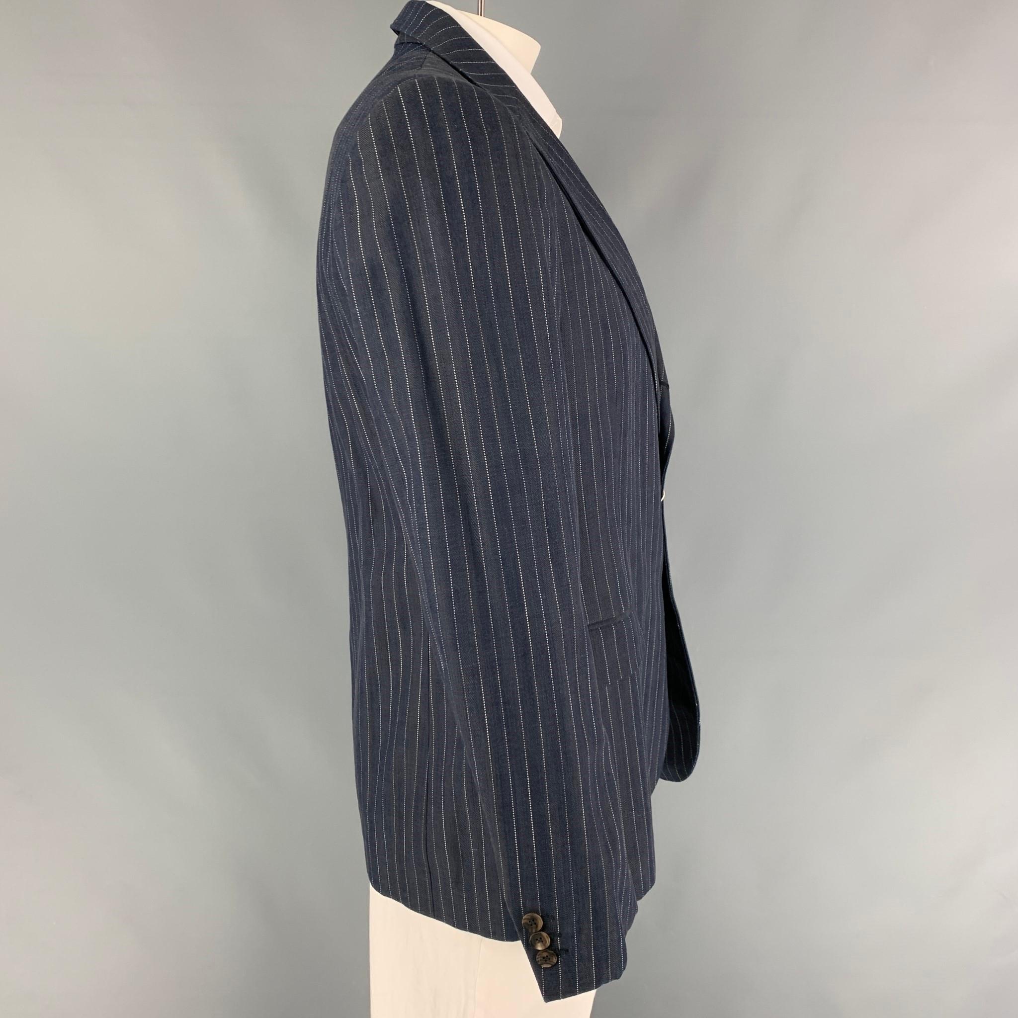 RRL by RALPH LAUREN sport coat comes in a indigo & white pinstripe cotton featuring a notch lapel, flap pockets, single back vent, and a three button closure. Made in Italy. 

New With Tags.
Marked: 44
Original Retail Price: