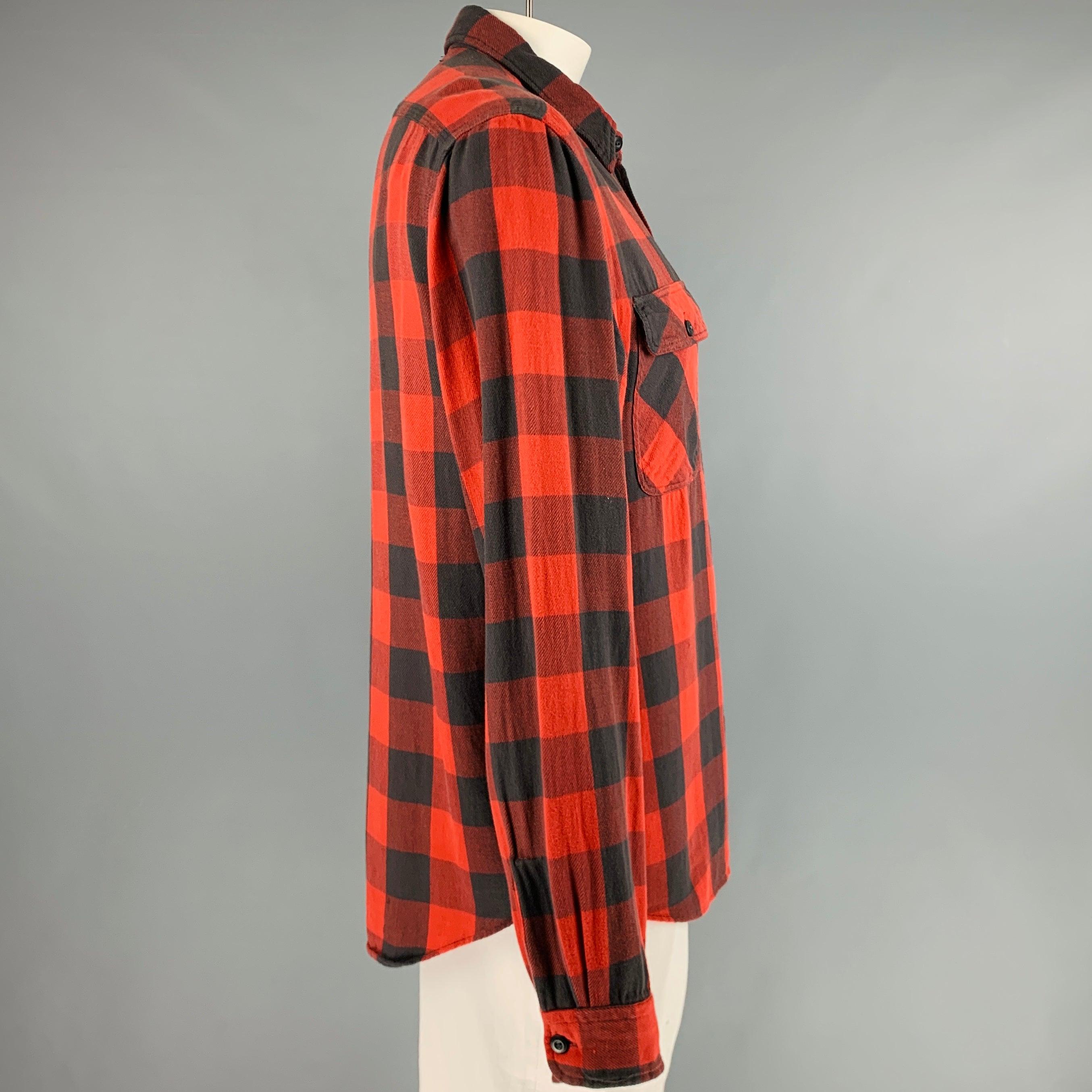 RRL by RALPH LAUREN long sleeve shirt
in a
red and black cotton fabric featuring buffalo plaid pattern, two pockets, and a button closure. Very Good Pre-Owned Condition. Minor signs of wear. 

Marked:   L 

Measurements: 
 
Shoulder: 17.5 inches
