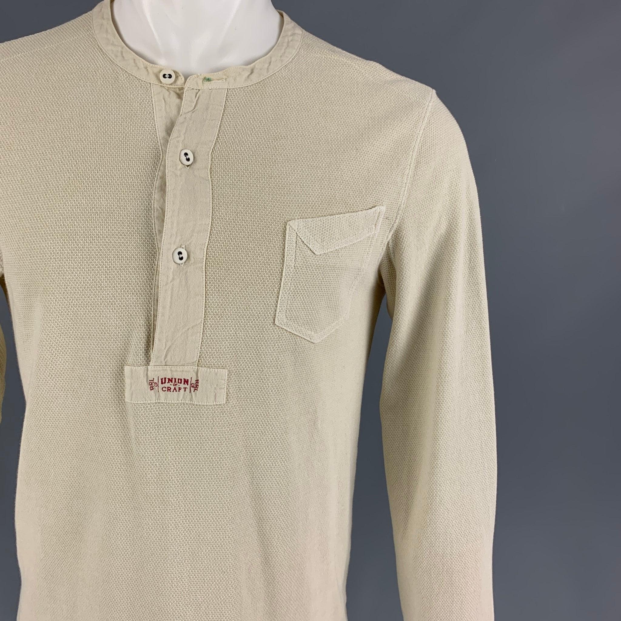 RRL by RALPH LAUREN long sleeve shirt comes in a beige textured cotton featuring a henley style, front small patch pocket, and a buttoned closure.
Good
Pre-Owned Condition. Minor discoloration at sleeve. As-is.  

Marked:   S 

Measurements: 

