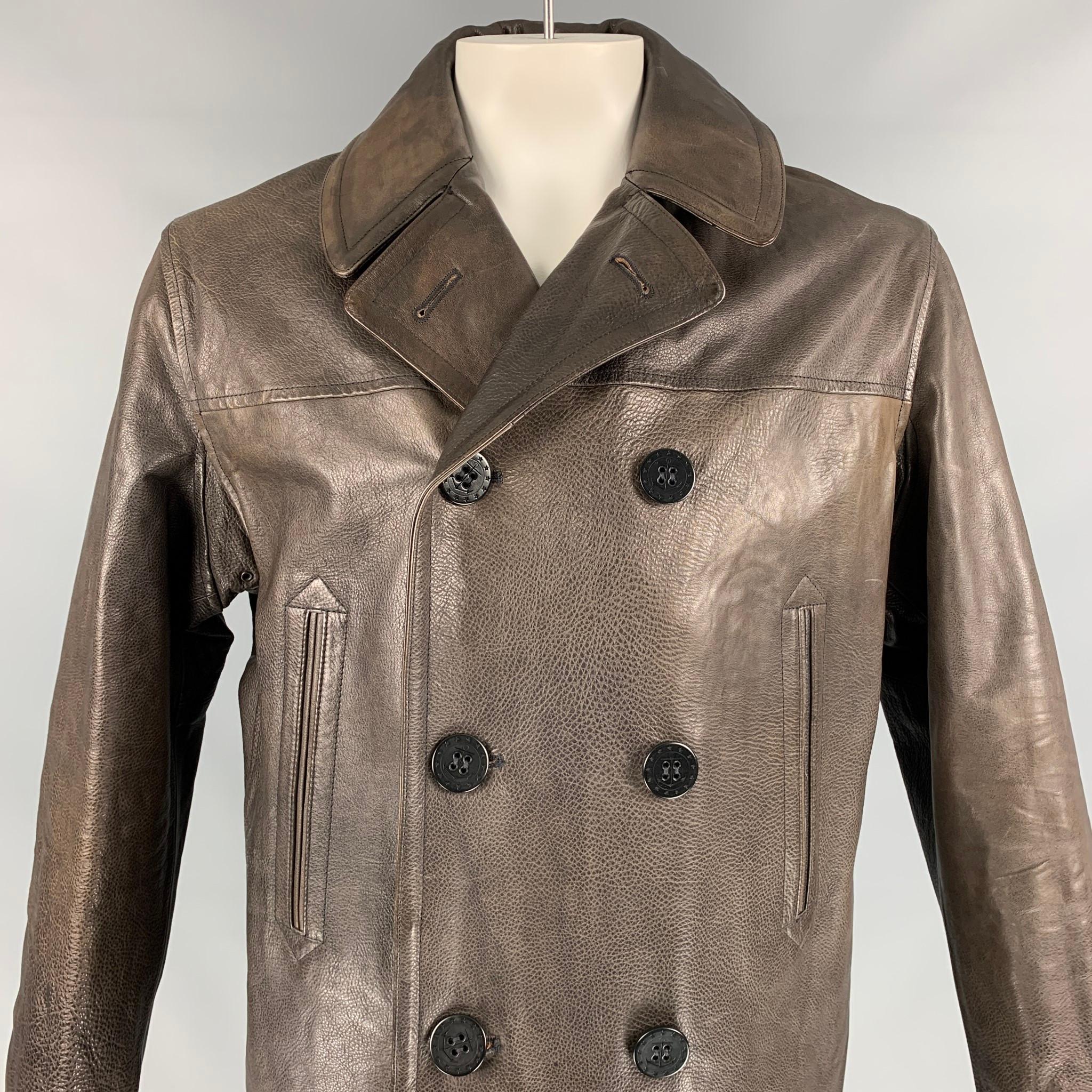 RRL by RALPH LAUREN pea coat comes in a brown leather with a full liner featuring a pointed collar, single back vent, slit pockets, and a double breasted closure.

Very Good Pre-Owned Condition.
Marked: XL

Measurements:

Shoulder: 19 in.
Chest: 44